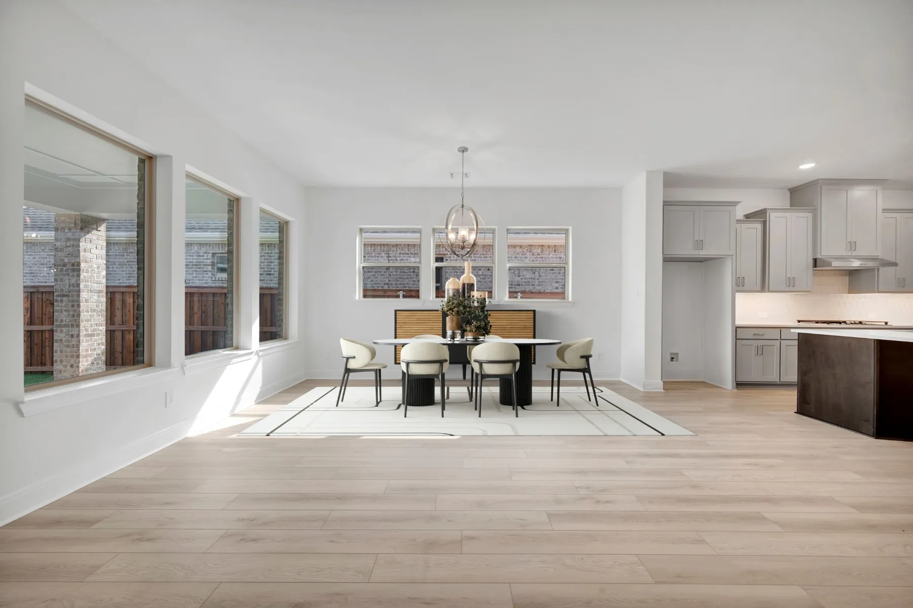 Dining room featuring light wood-type flooring and hanging lights
