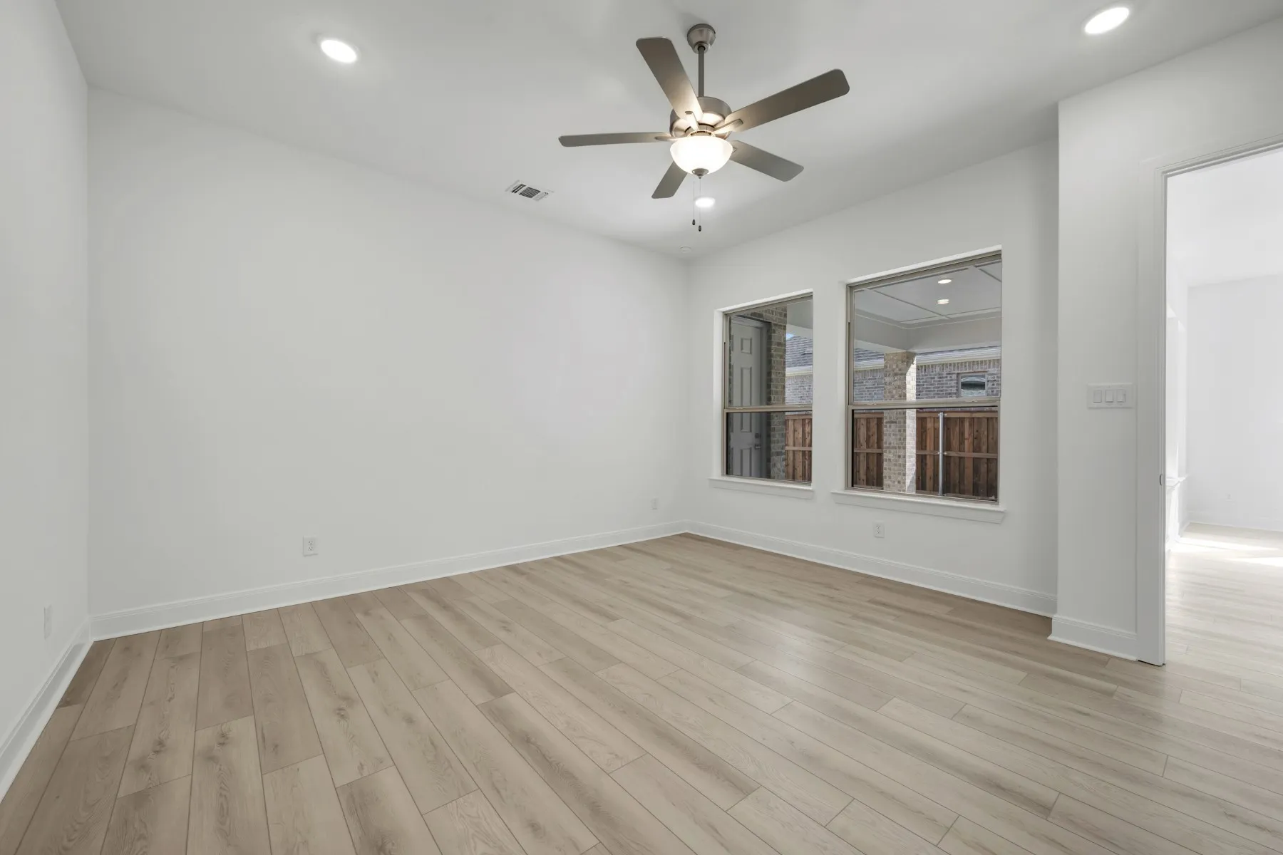 Unfurnished room with a ceiling fan, recessed lighting, and light wood-style flooring