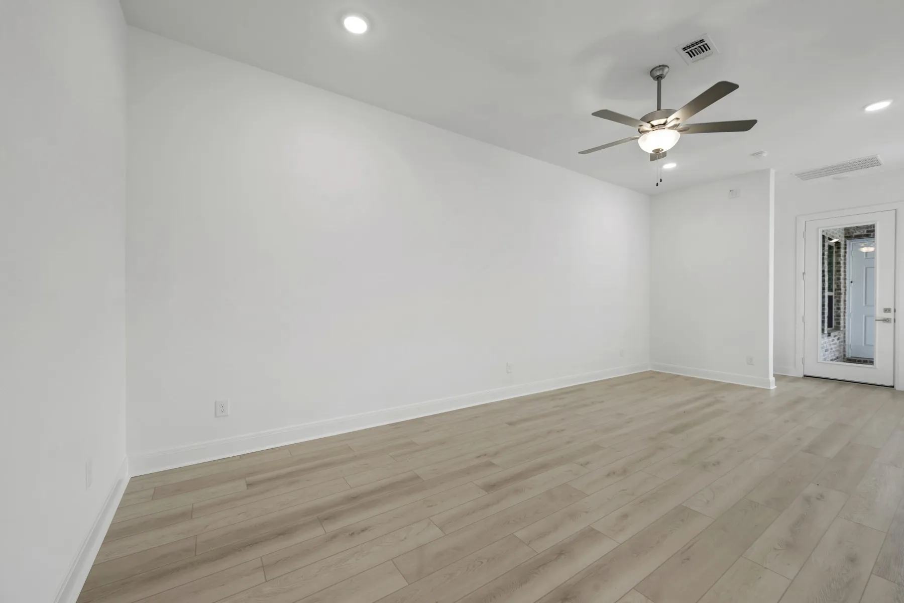 Unfurnished room with recessed lighting, light wood-type flooring, and ceiling fan