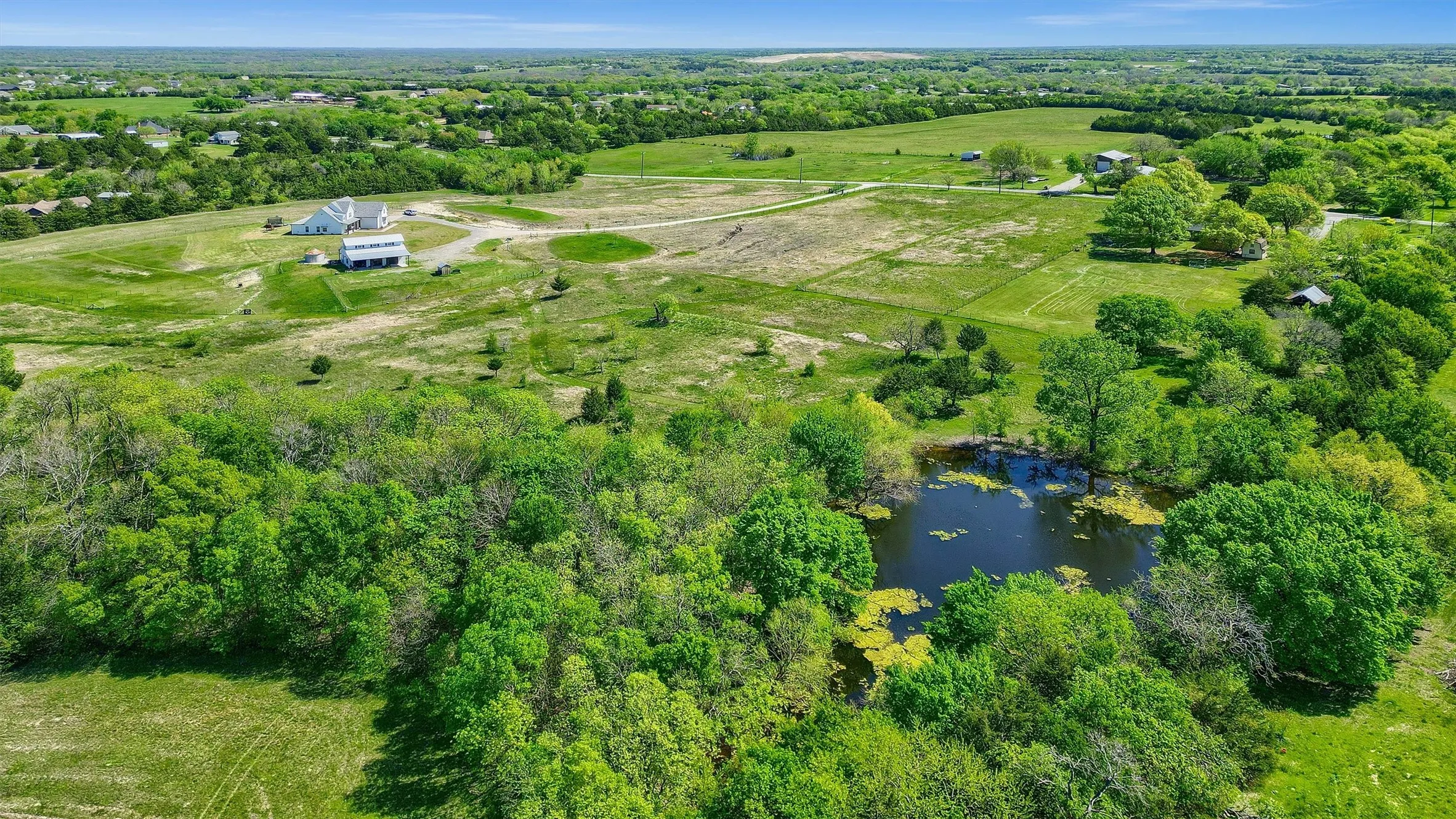 Aerial view with a water view and a rural view