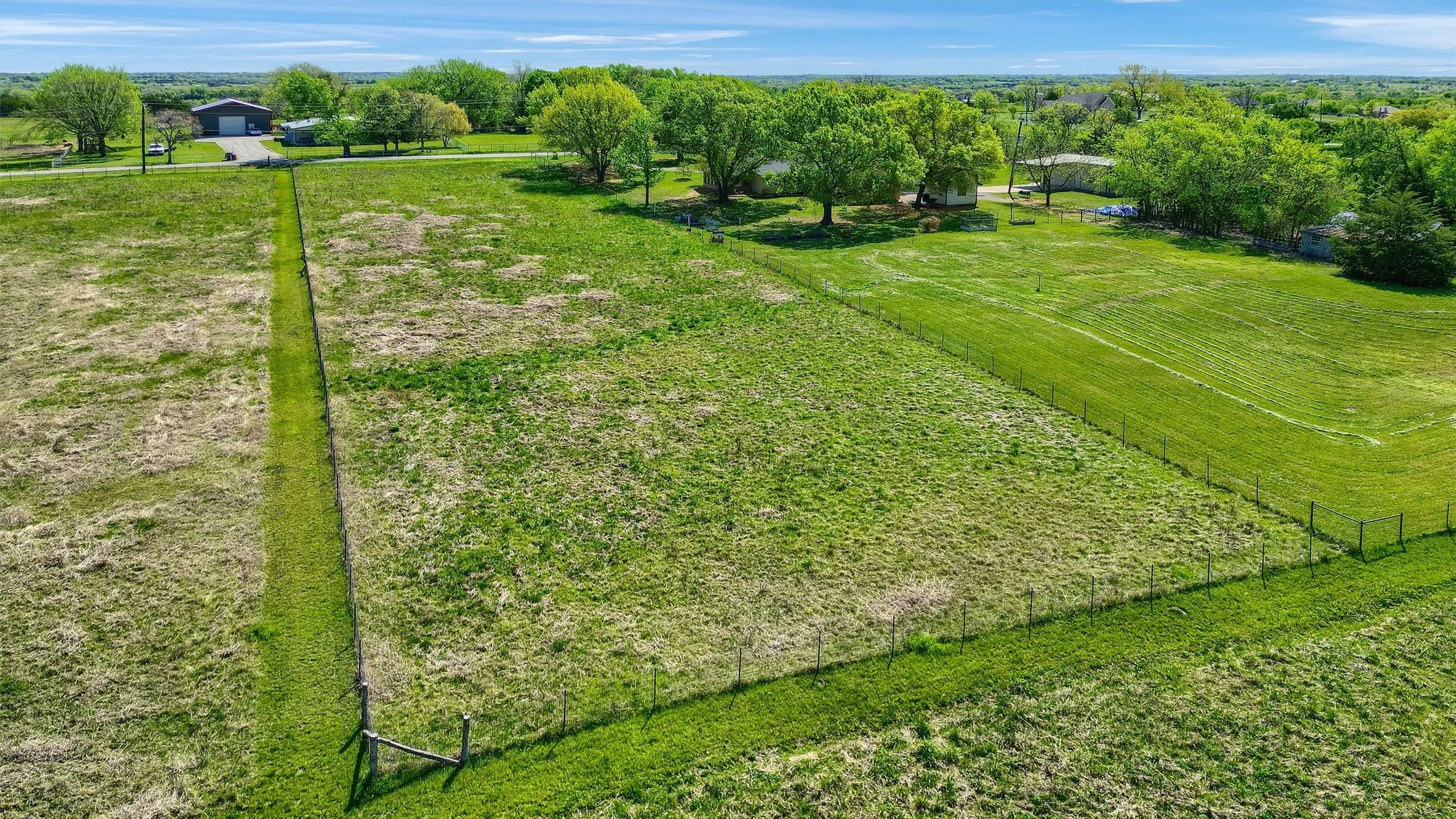 Birds eye view of property with a rural view