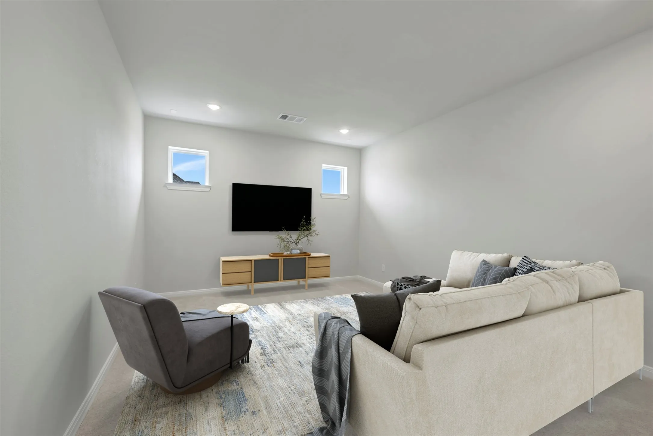 Living area with recessed lighting and carpet flooring