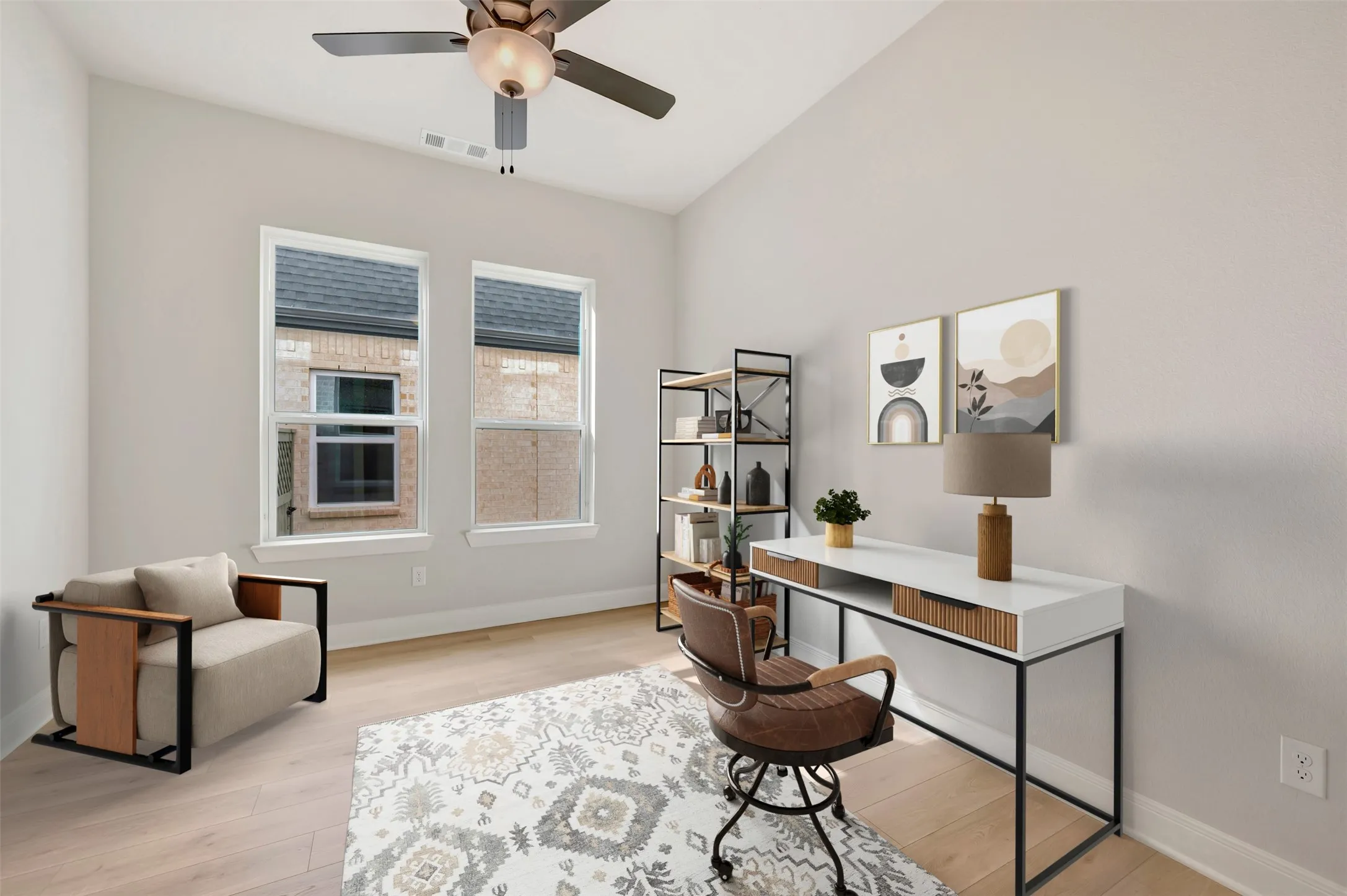 Home office featuring light wood-style floors and ceiling fan