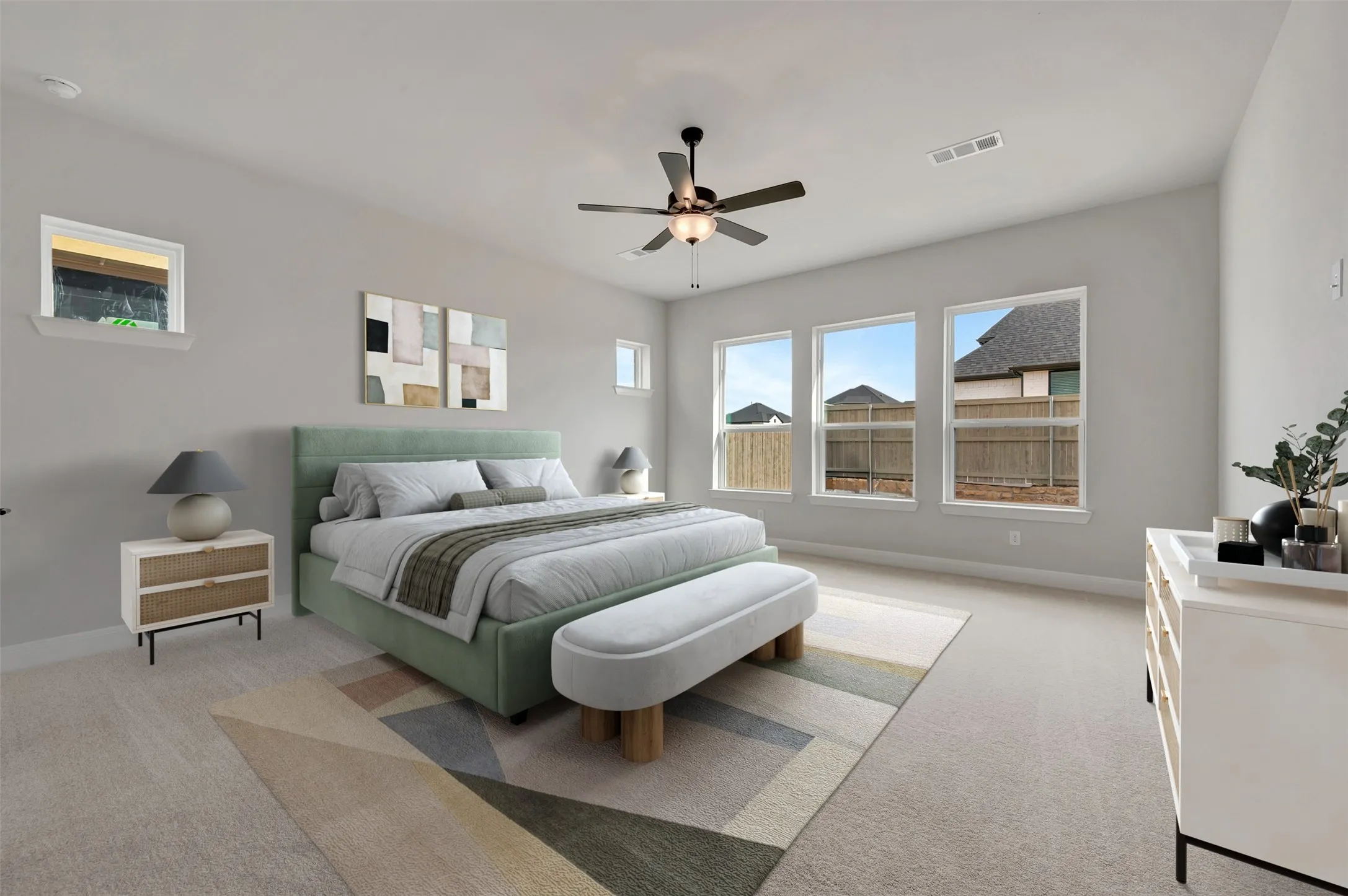 Bedroom featuring ceiling fan and light carpet