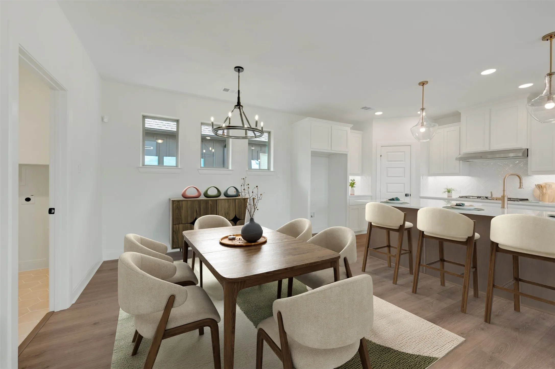Open-concept living space with wood-finish flooring