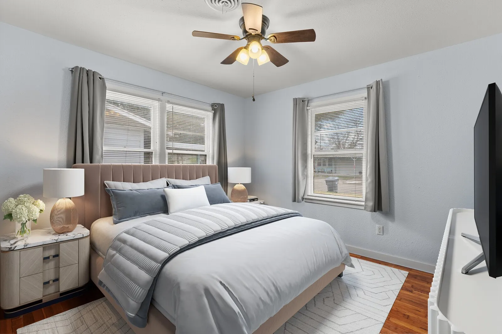 Bedroom featuring wood finished floors and a ceiling fan(virtual photo used to demonstrate spacing and room size.)