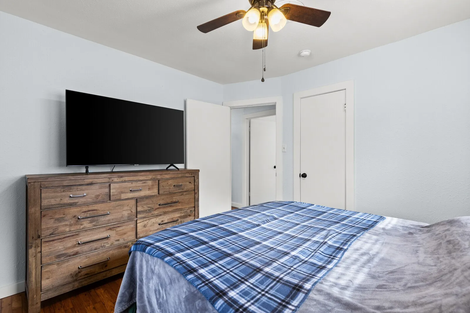 Bedroom featuring a ceiling fan and wood finished floors