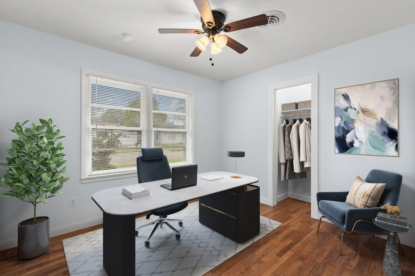Office space with dark wood-type flooring and ceiling fan(virtual photo used to demonstrate spacing and room size.)