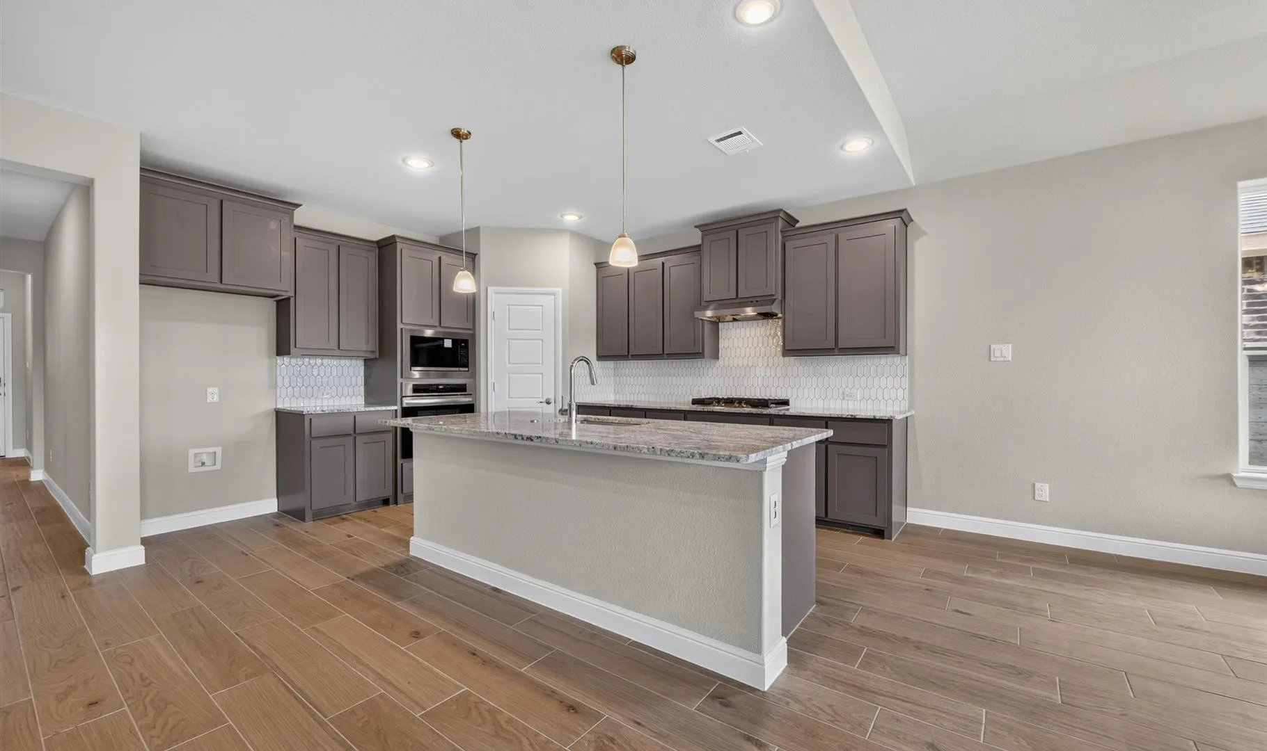 Kitchen-All Home and community information, including pricing, included features, terms, availability and amenities, are subject to change at any time without notice or obligation. All Drawings, pictures, photographs, video, square footages, floor plans, elevations, features, colors and sizes are approximate for illustration purposes only and will vary from the homes as built.