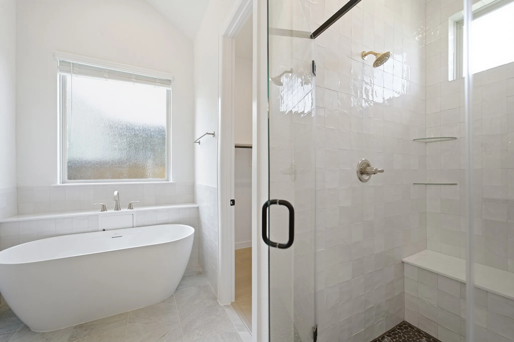 Freestanding soaking tub with deck-mounted faucet