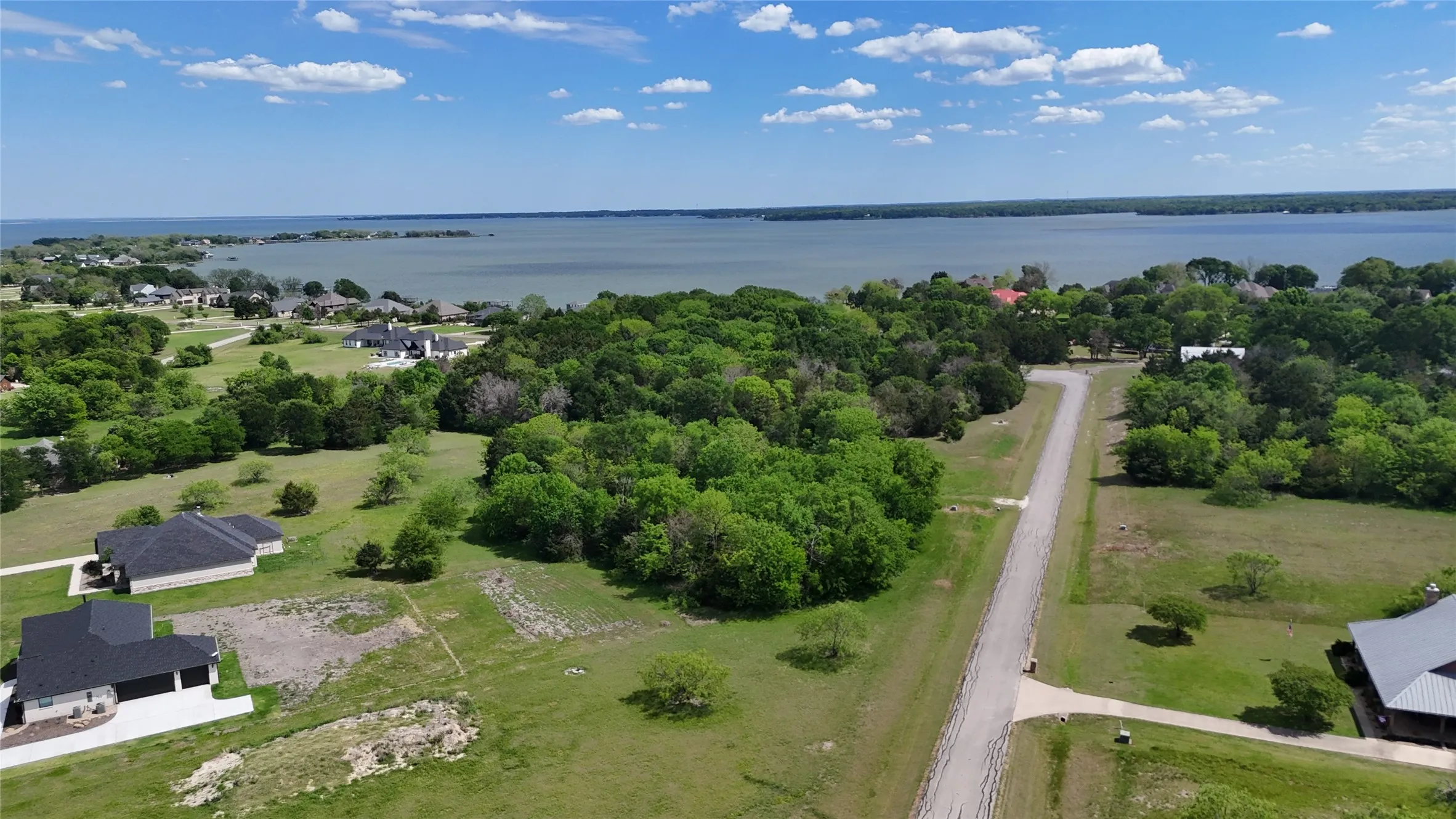 Mature trees create natural privacy and character on this spacious building lot near Richland Chambers Lake in Navarro County.