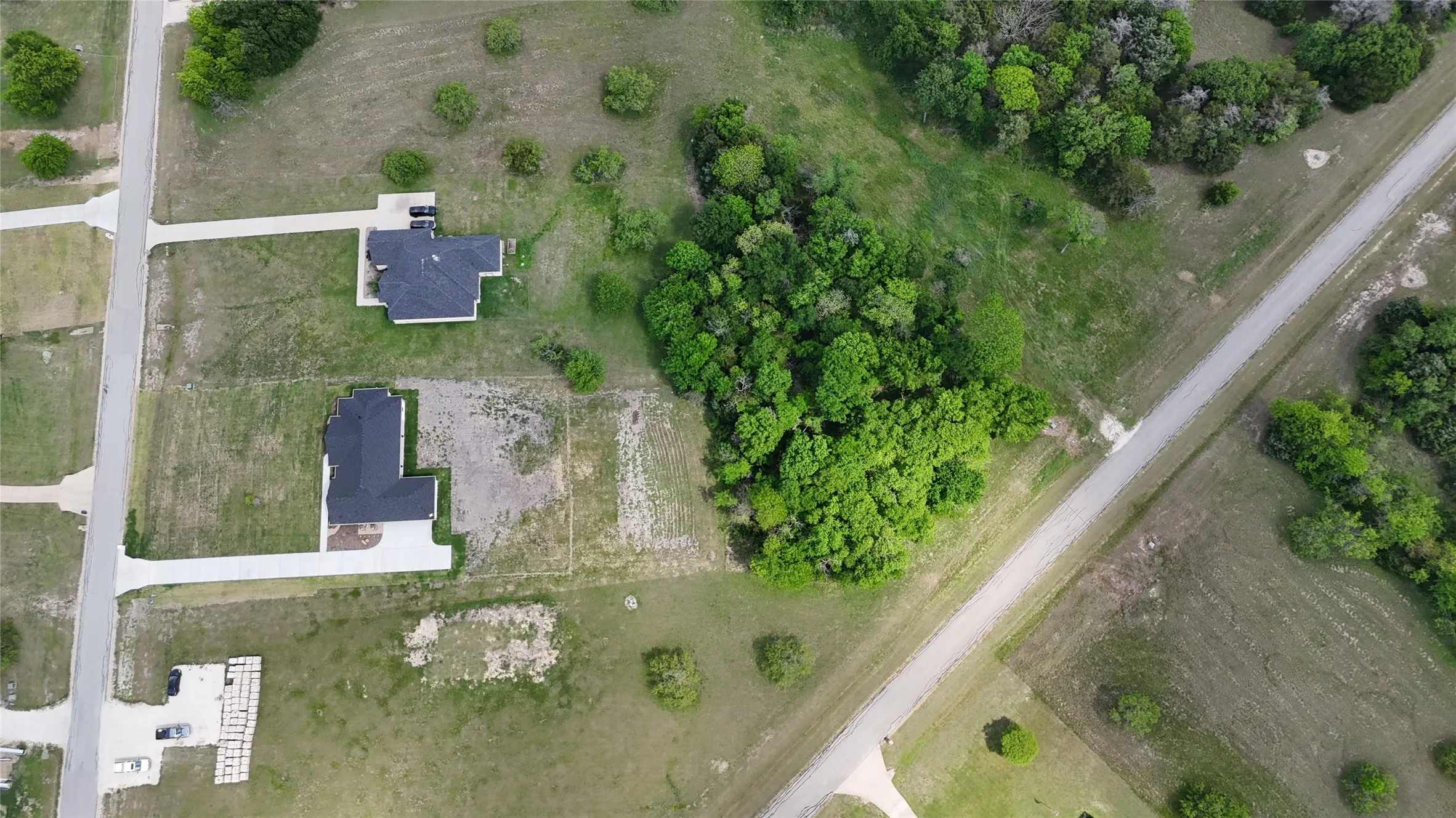 Mature tree coverage gives Lot 194 a secluded feel while keeping the property close to lake recreation and community amenities.