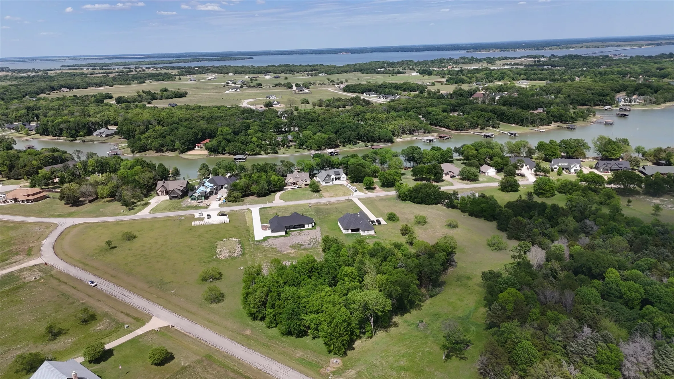 Elevated view showcases the wooded homesite and its desirable location near the expansive waters of Richland Chambers Lake.