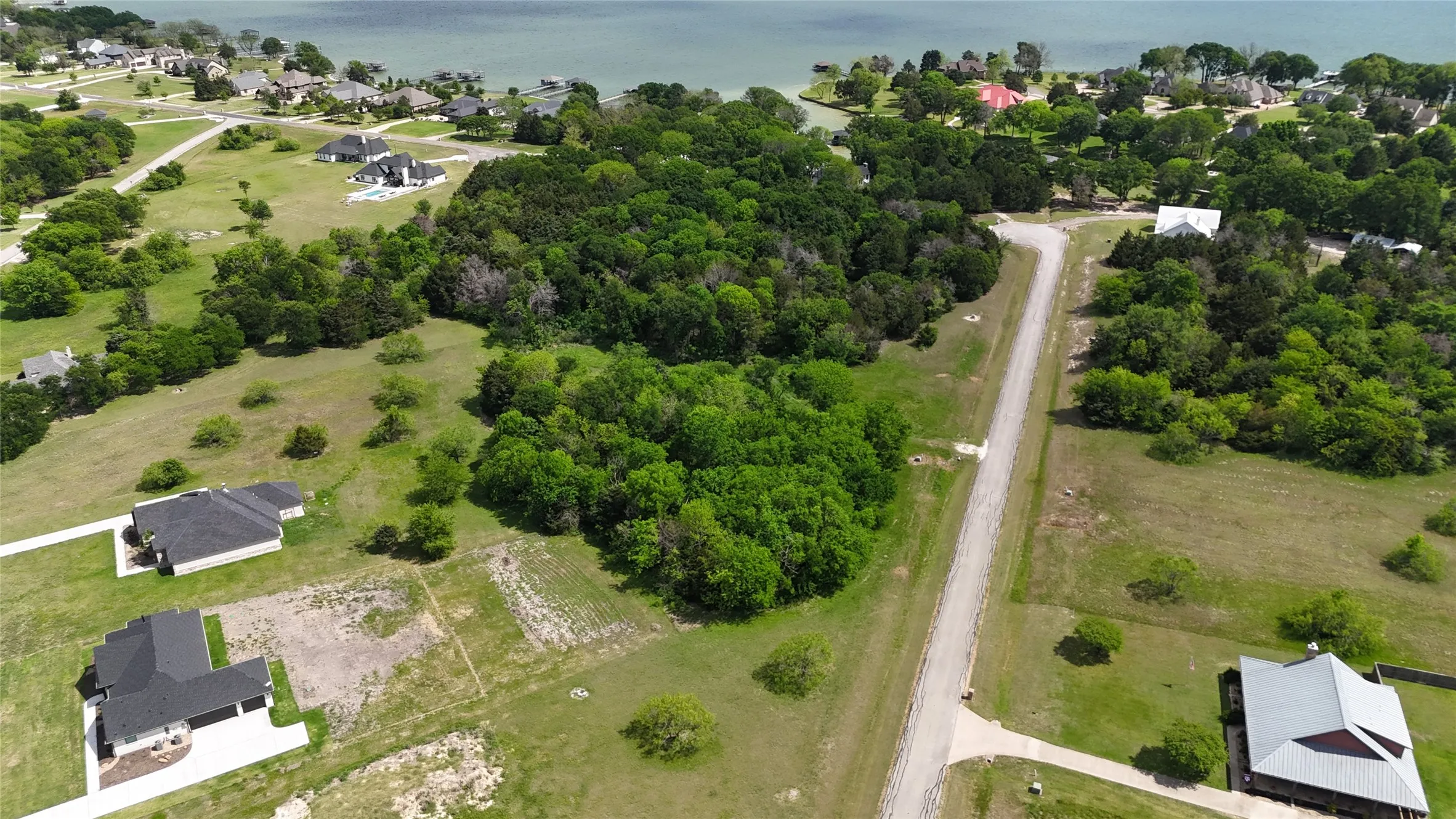 Wooded Lot 194 offers privacy within an established lake community, ideal for buyers considering retirement or relocation to Richland Chambers Lake.
