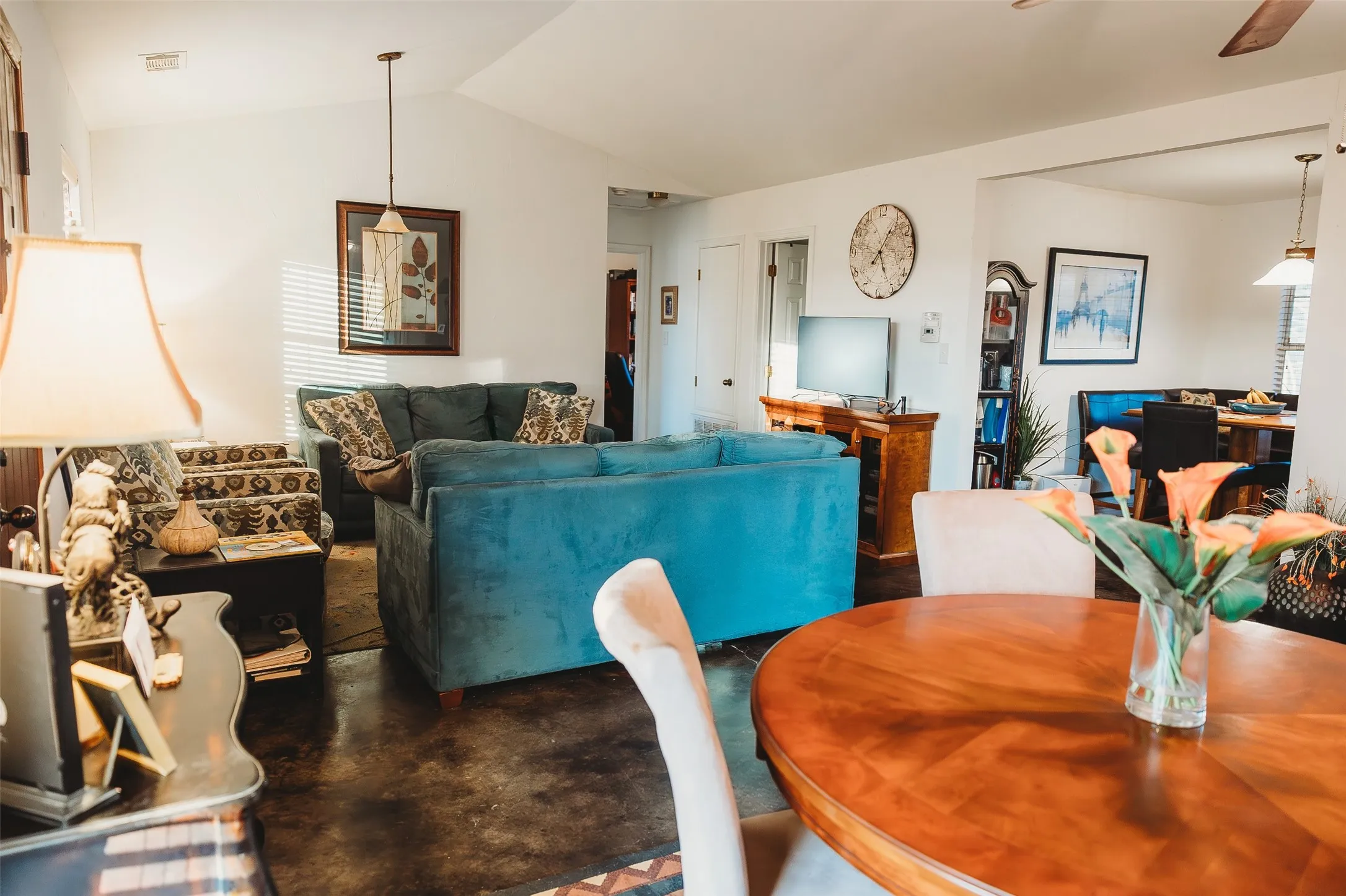Dining area featuring lofted ceiling and a ceiling fan
