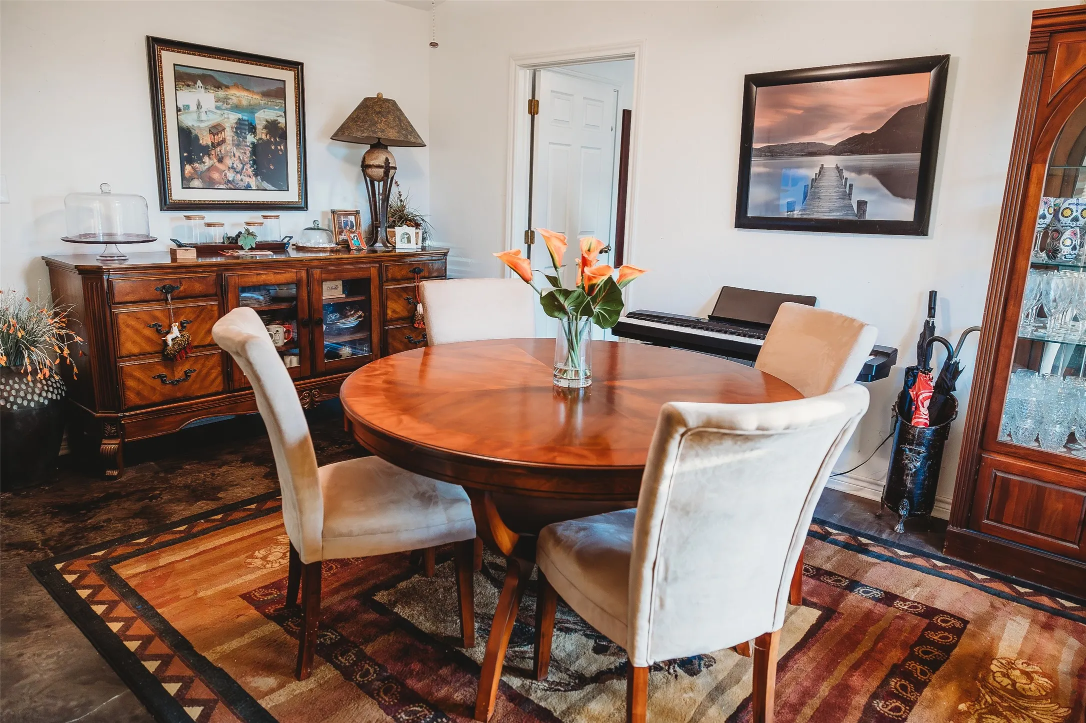Dining area with dark wood-style floors
