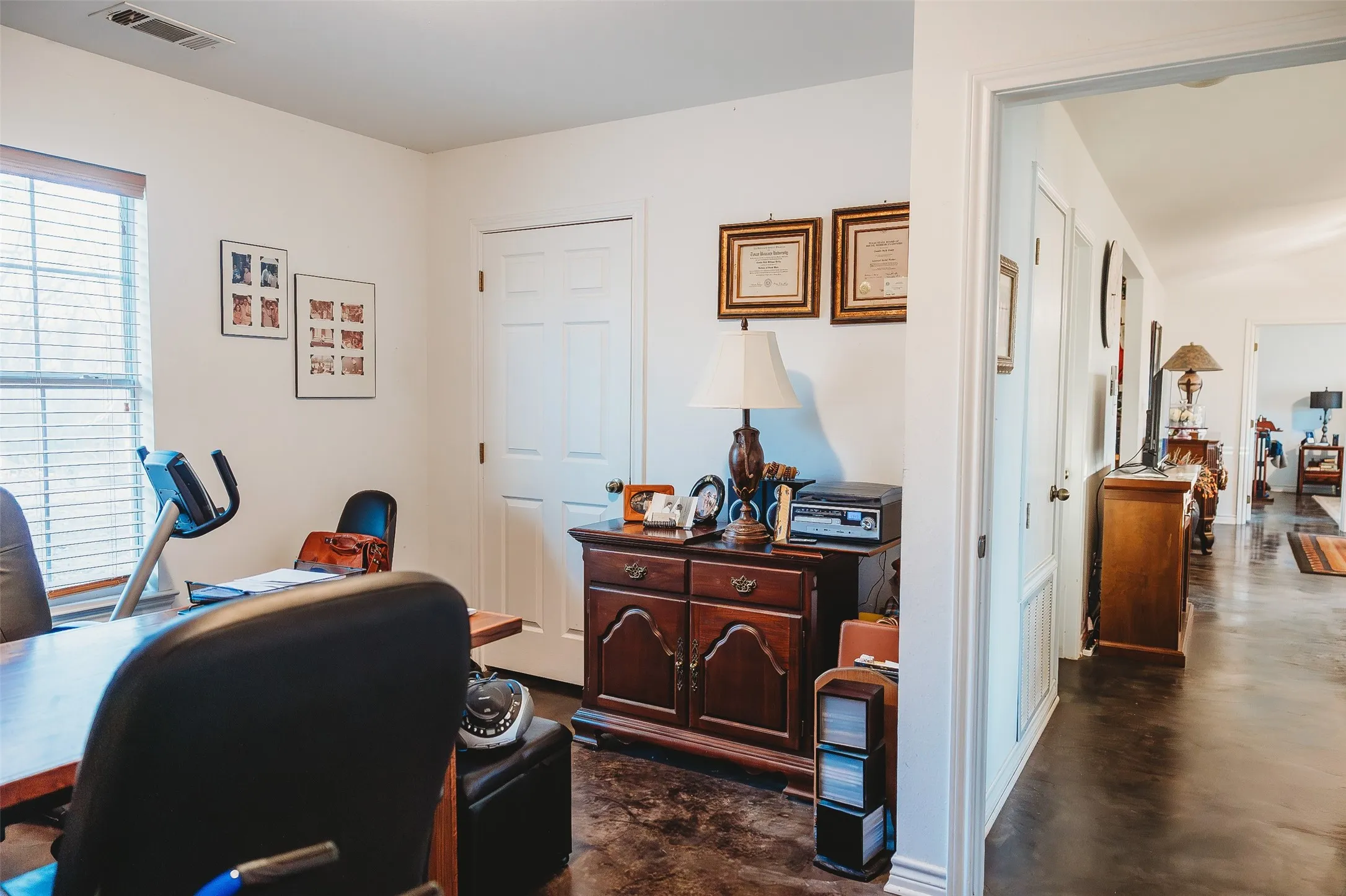 Office space featuring concrete flooring and baseboards