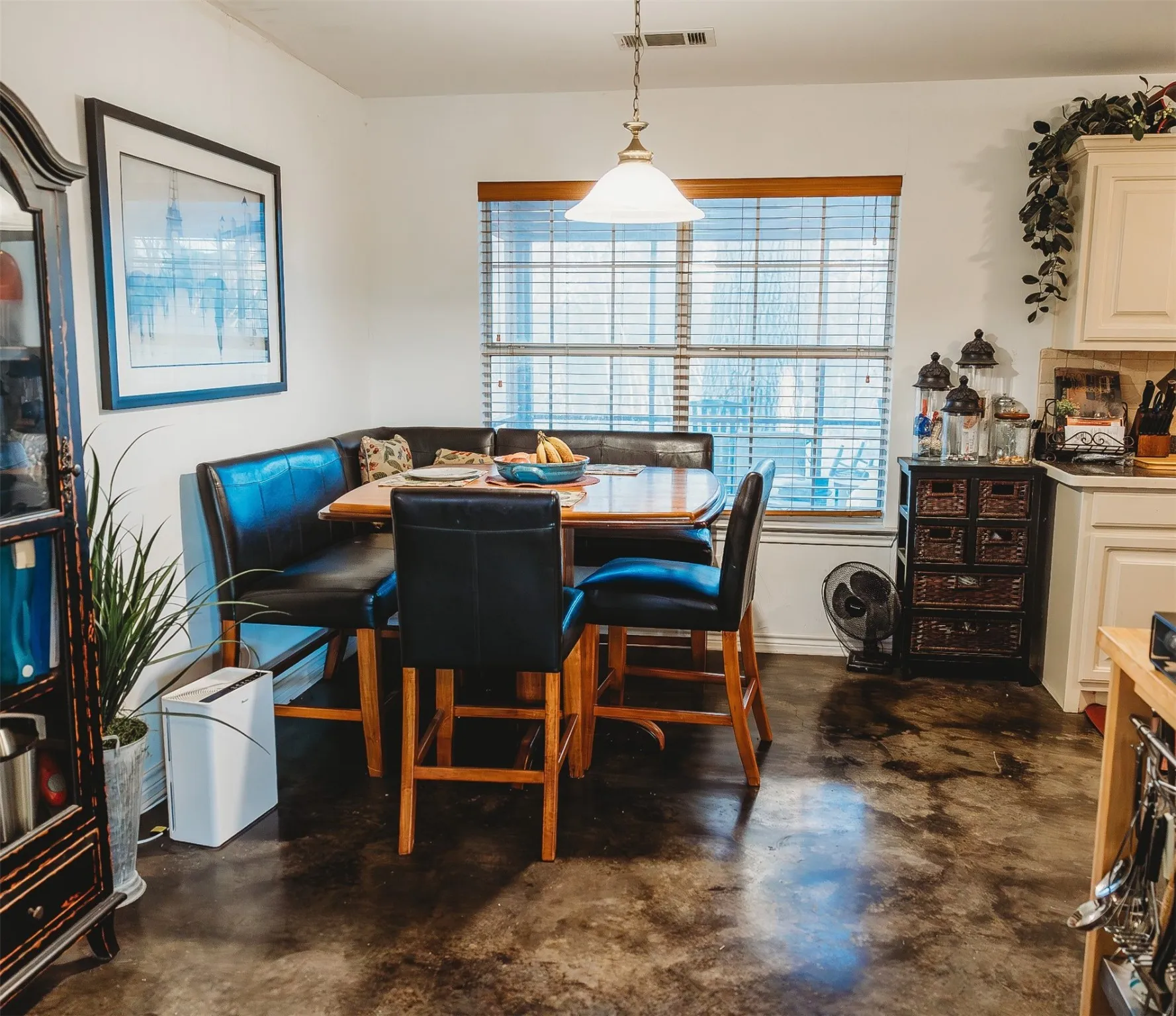 Dining room with concrete flooring