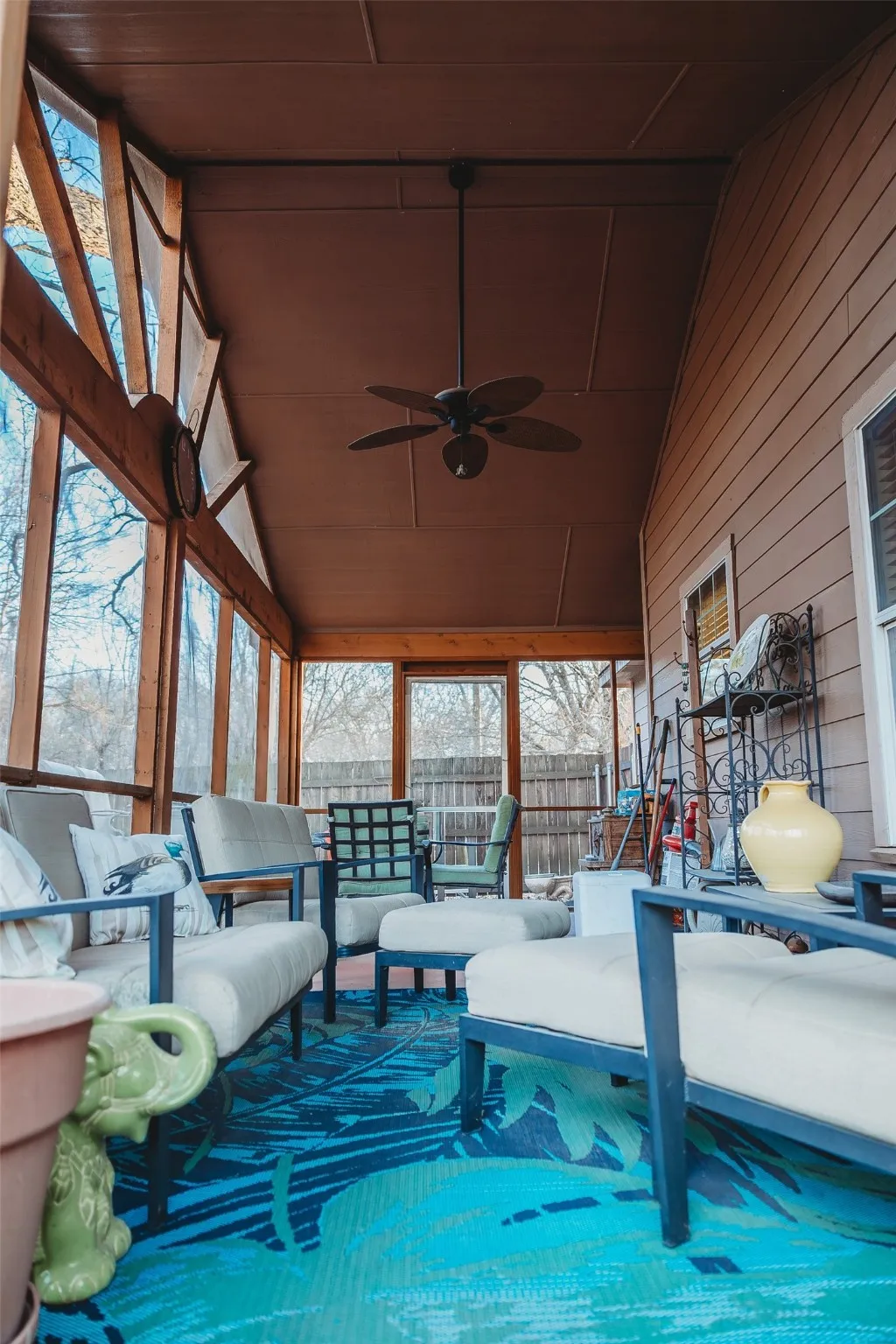 View of pool featuring outdoor lounge area and a sunroom