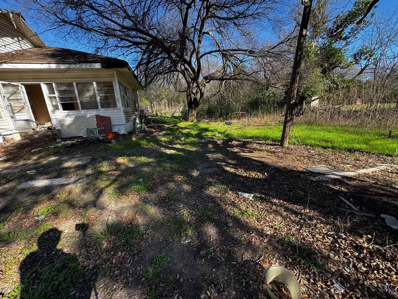 View of yard with a sunroom