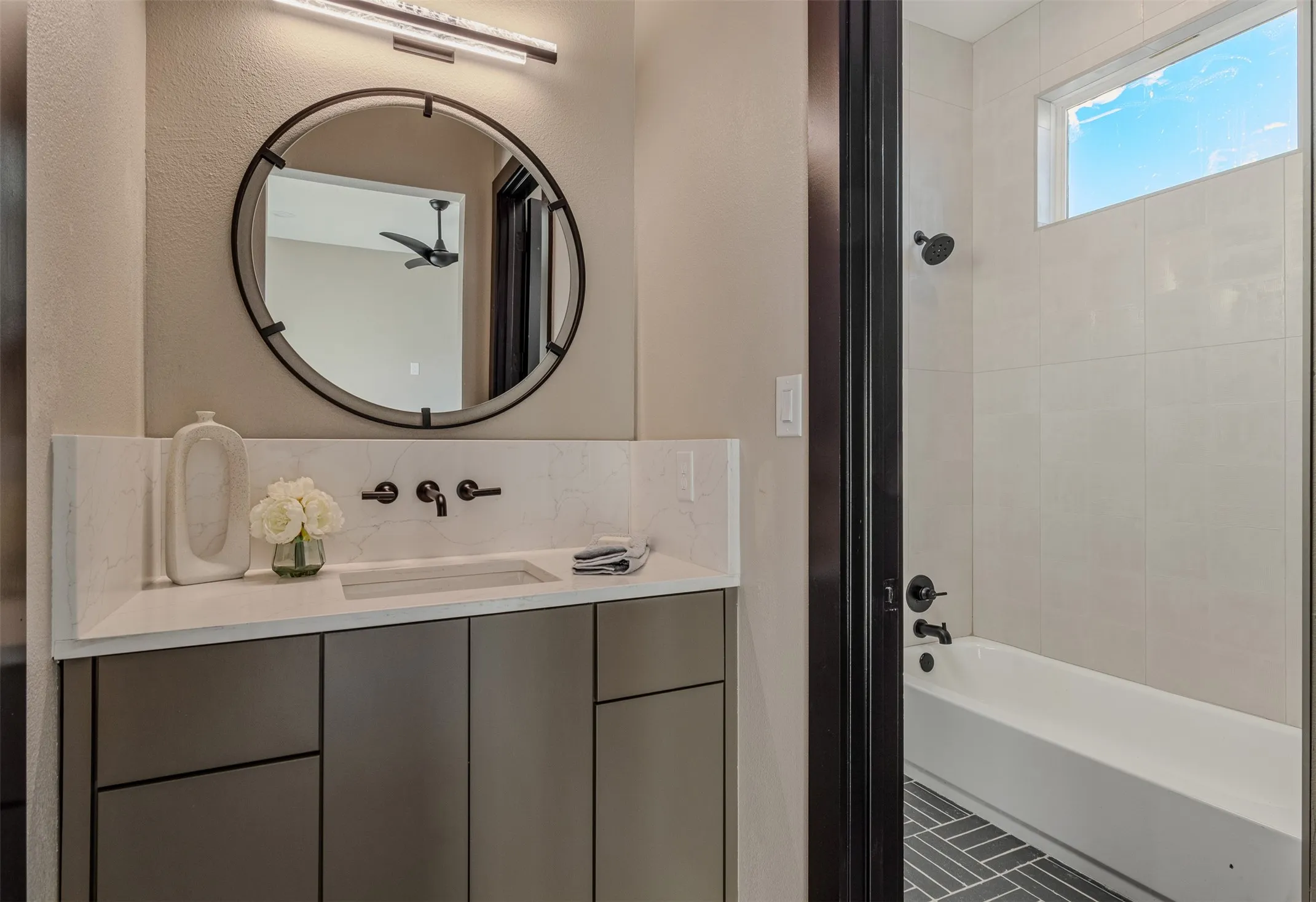 Bathroom with vanity and bathtub / shower combination