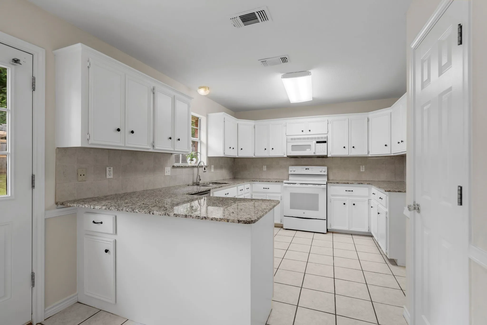 Abundant cabinets and counters!