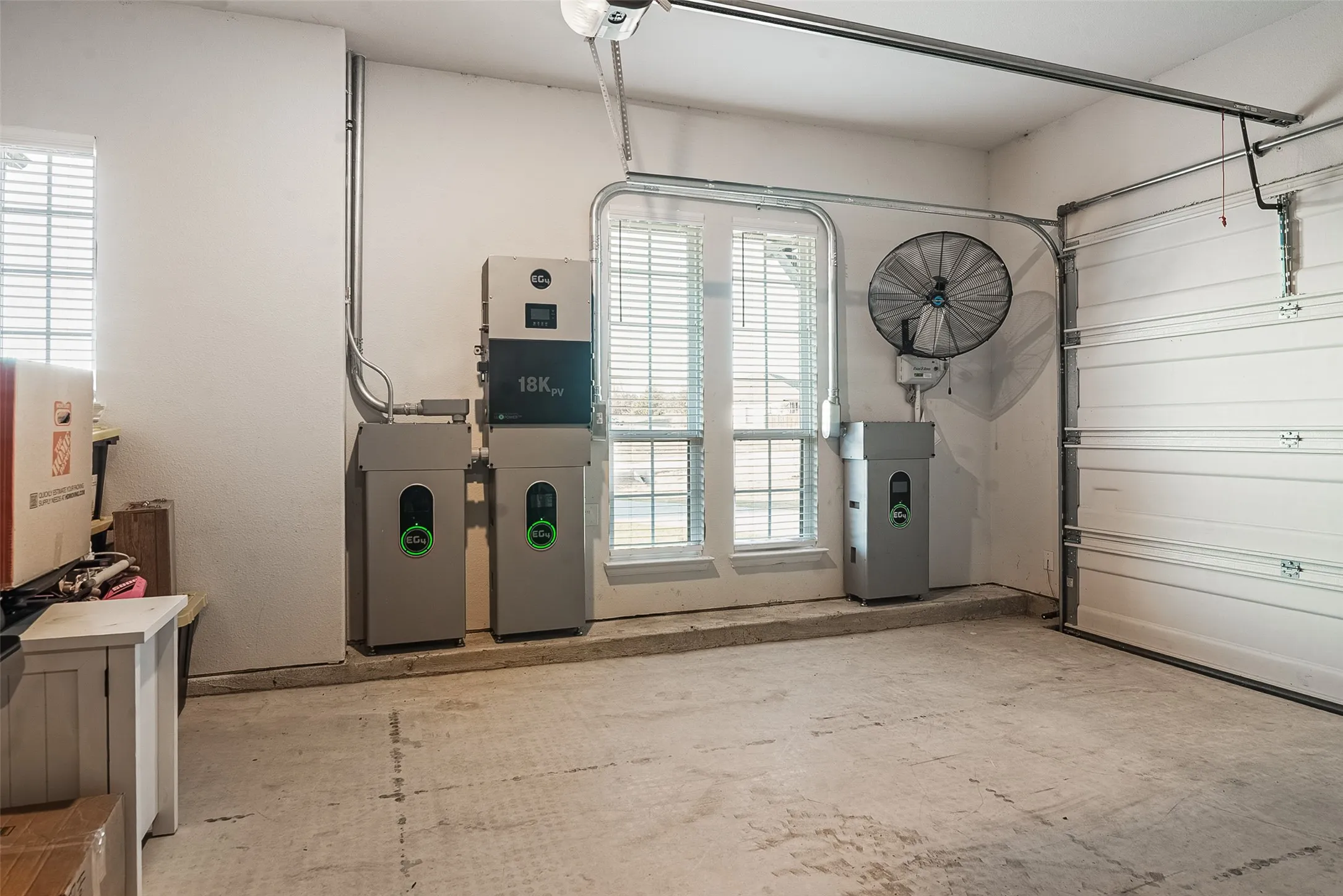 This home features a whole-home solar energy system paired with battery backup storage. The system includes multiple EG4 lithium battery modules and an 18K PV inverter mounted in the garage. This setup allows excess solar energy to be stored and used during peak hours, outages, or low-sunlight conditions, providing increased energy efficiency, resiliency, and long-term cost savings.
