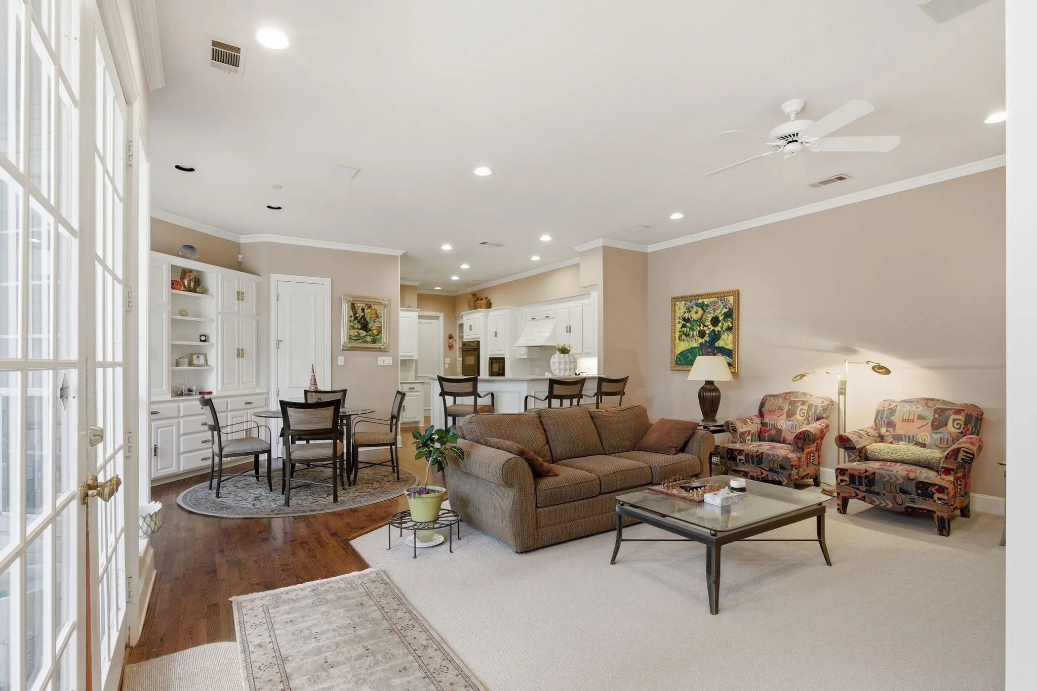 Living area featuring ornamental molding, dark wood-style floors, a ceiling fan, and recessed lighting