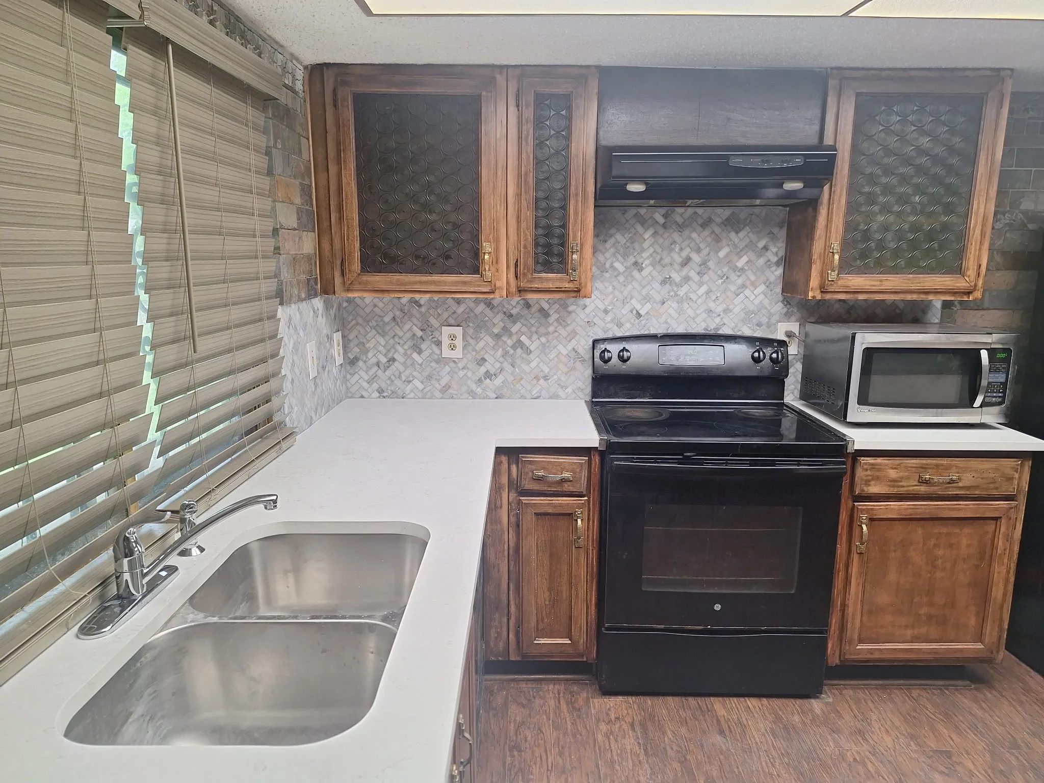 New backsplash, counter and sink installed March 2026.