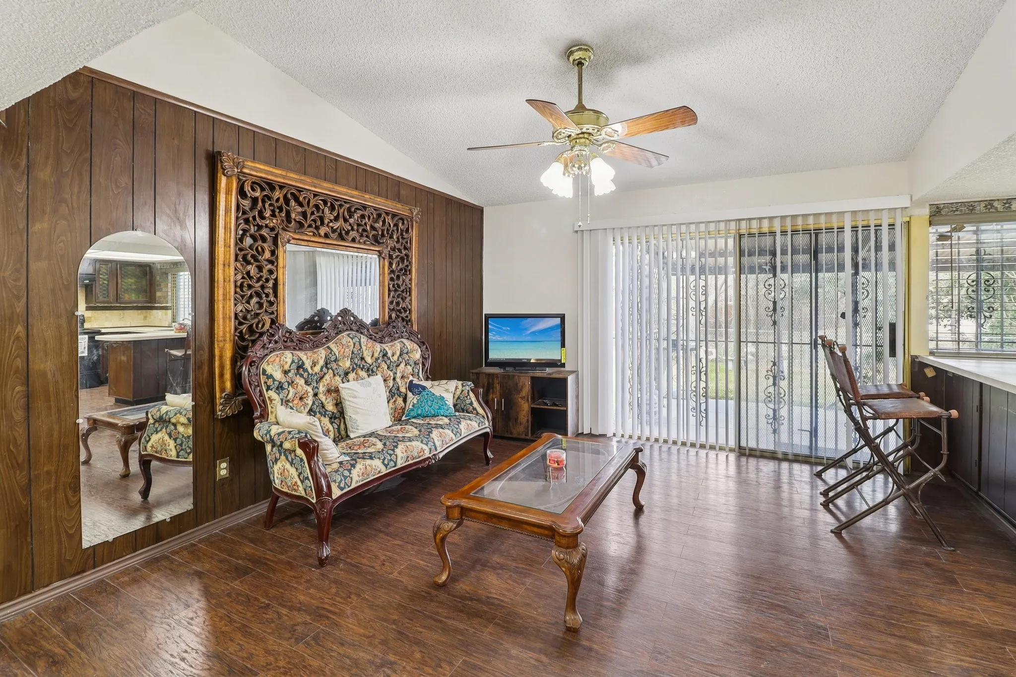 Another view of the family room which is open to the kitchen.  Sliding glass doors lead to a covered patio and backyard.