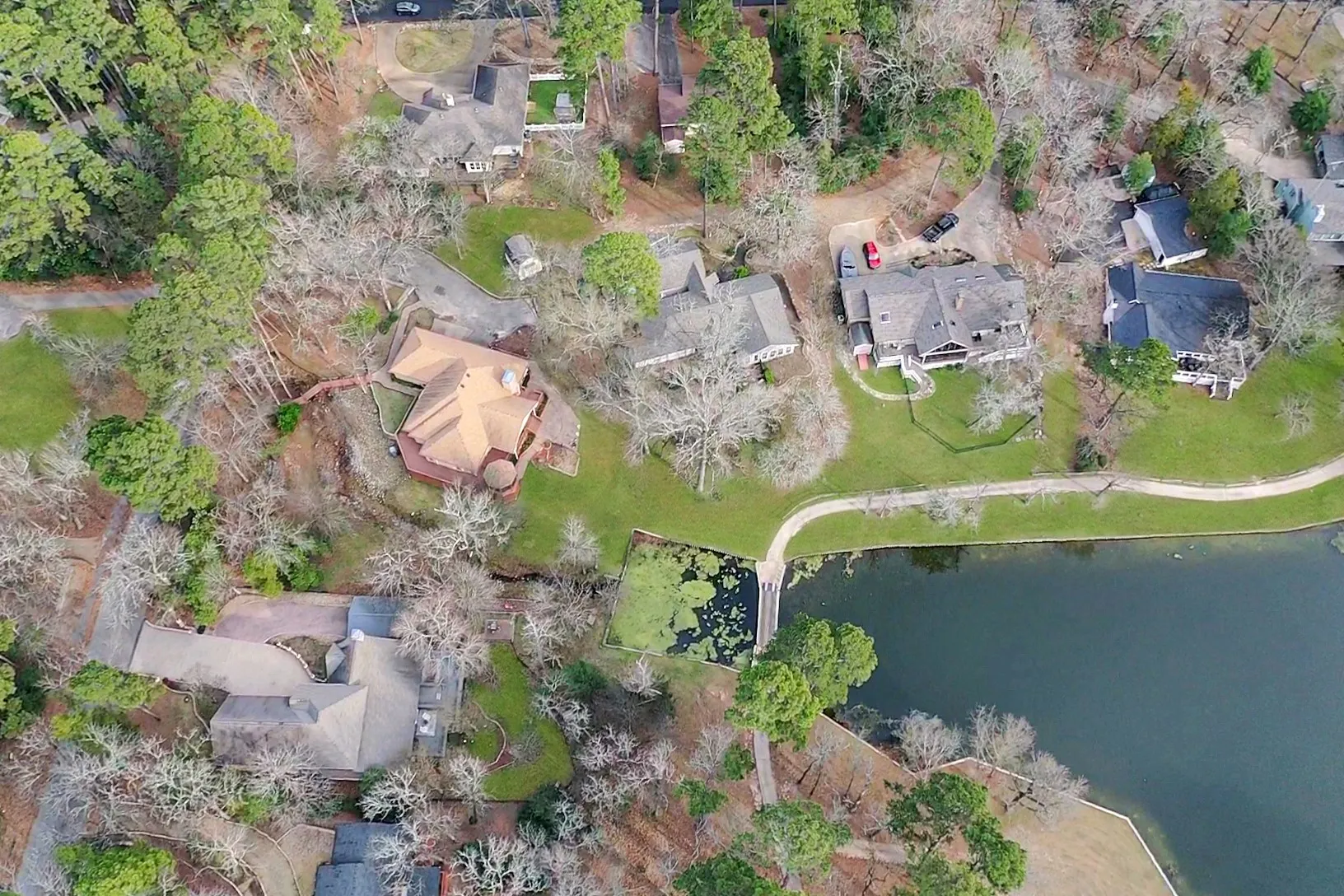 View of property location with nearby suburban area and a large body of water