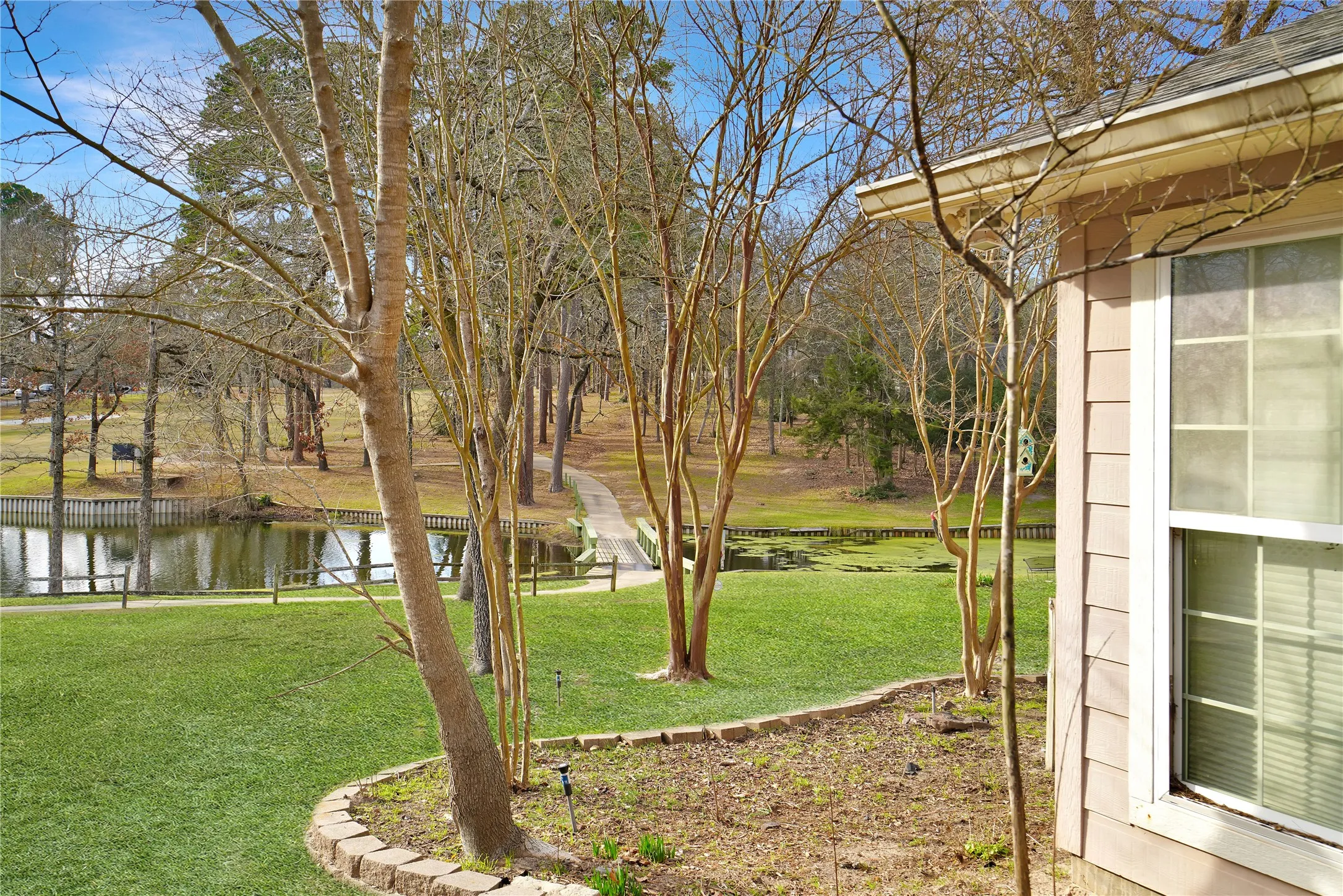 View of green lawn featuring a water view