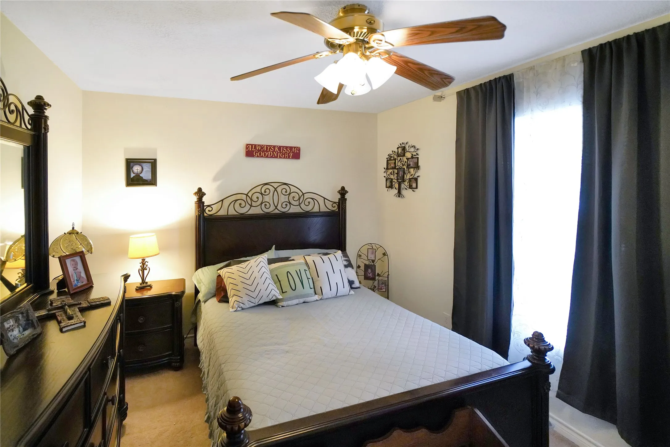 Bedroom featuring light colored carpet and a ceiling fan