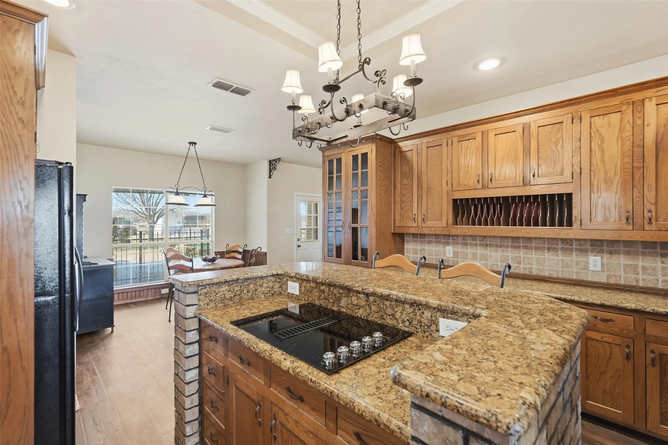 Cook top conveniently located in island.