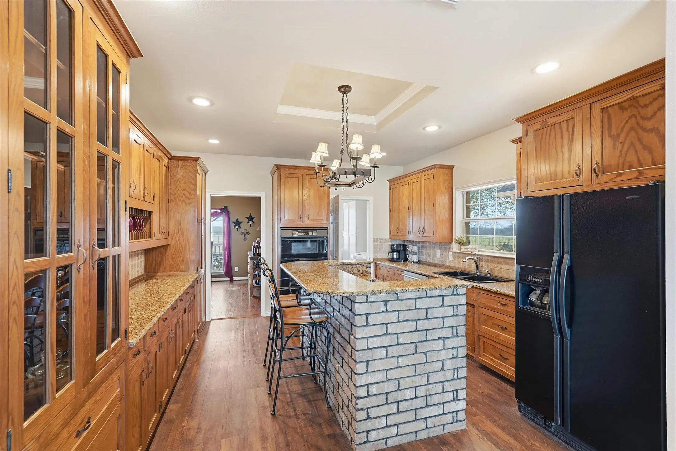 Wonderful storage in beautiful cabinets with granite counter tops.