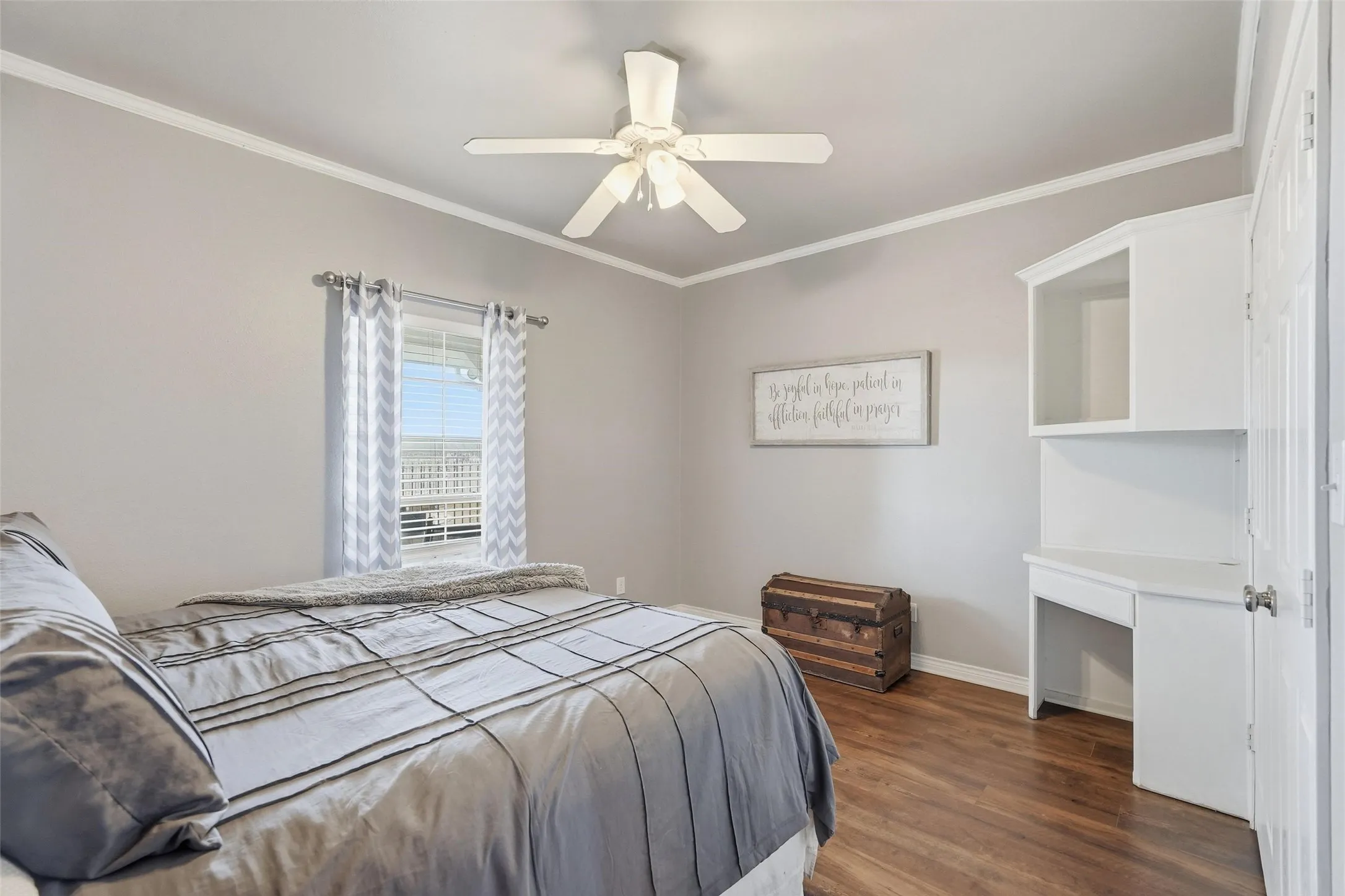This secondary bedroom has a built in desk.