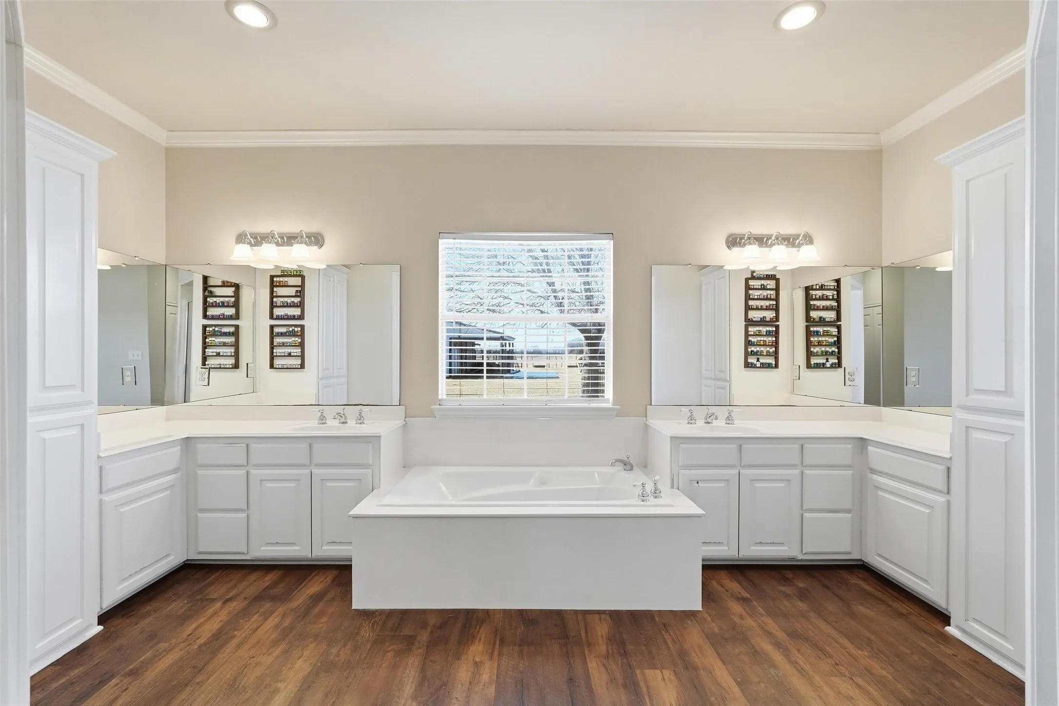 Large primary bath with dual sinks and jetted tub.