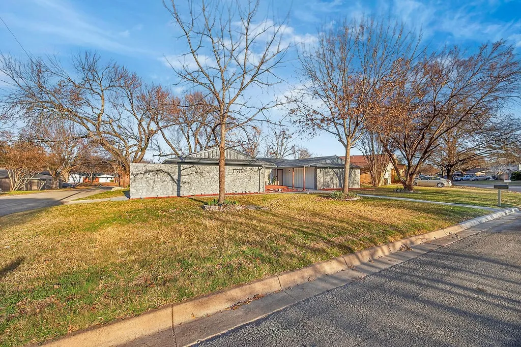 View of front of property with a front yard