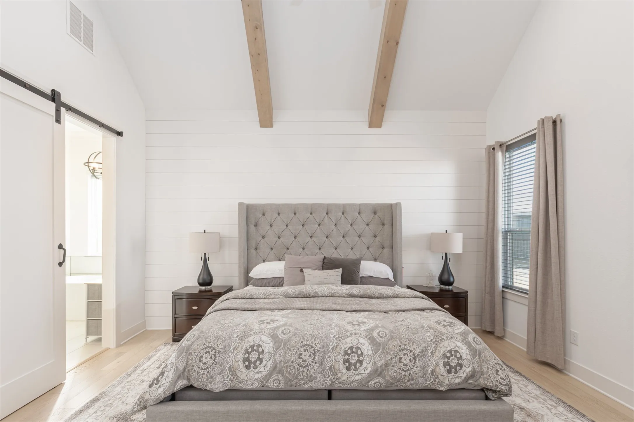 Primary Bedroom with Vaulted Ceiling and Stained Beams