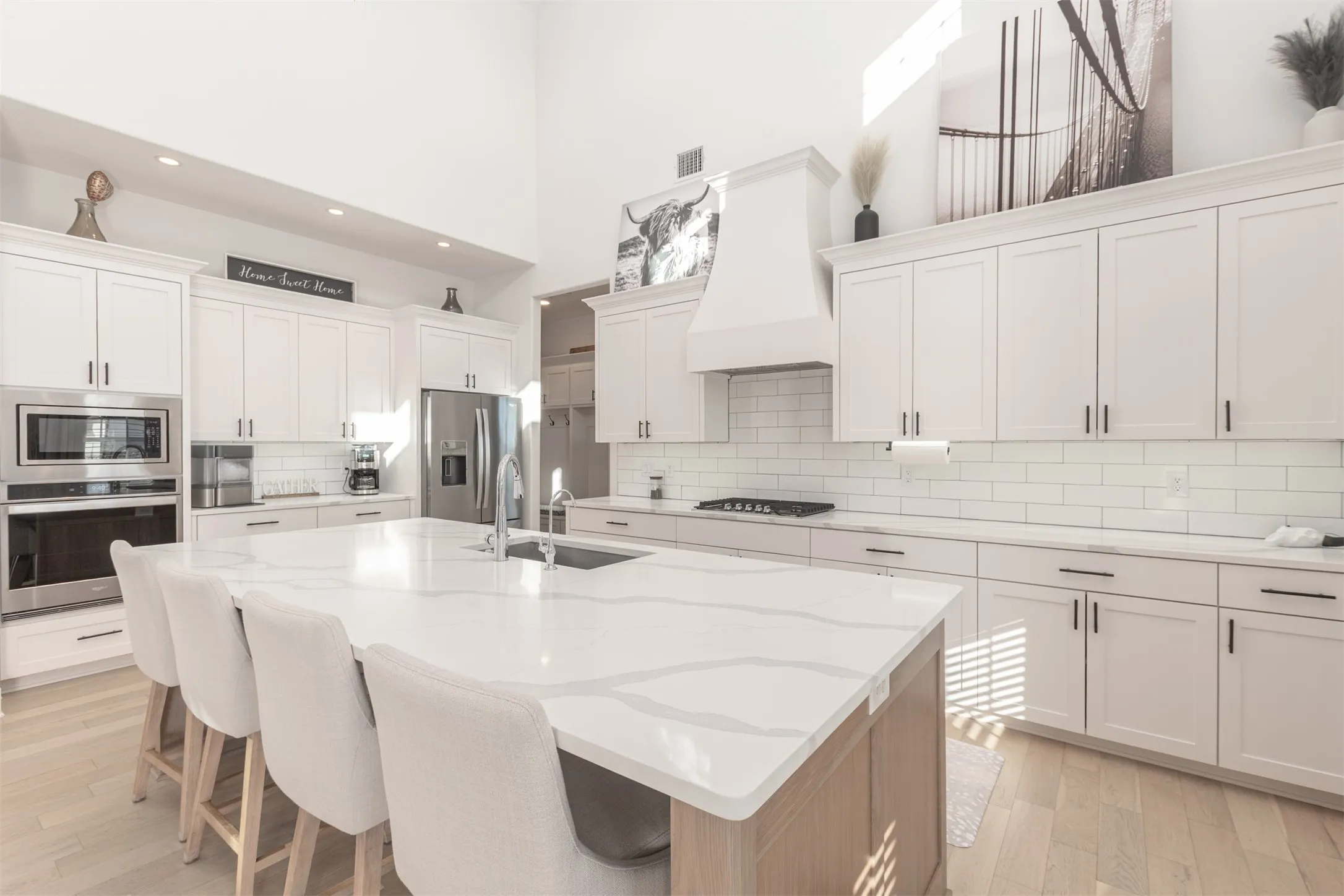 Oversized Kitchen Island with an abundance of kitchen counter space and cabinets