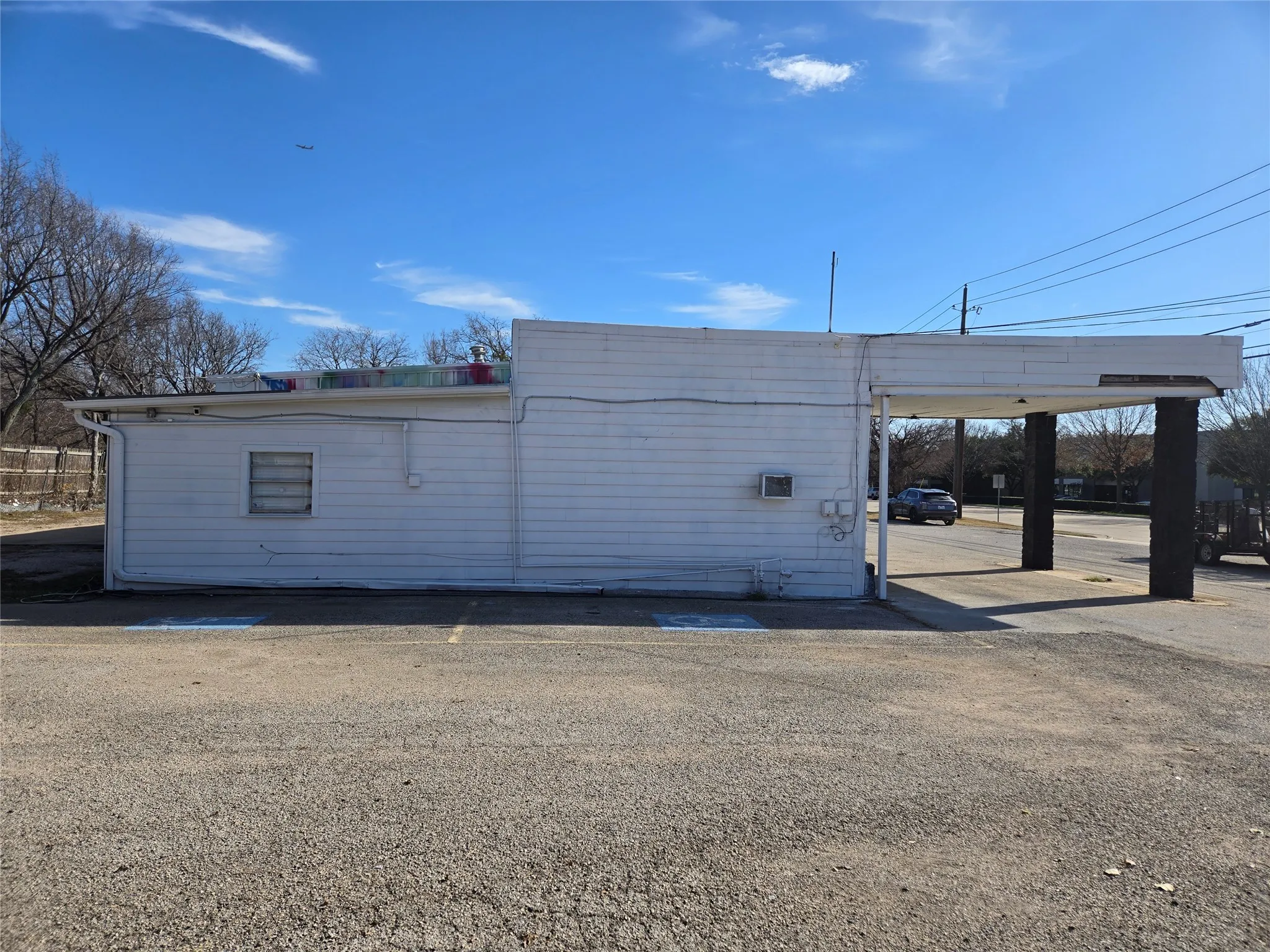 View of property featuring an attached carport