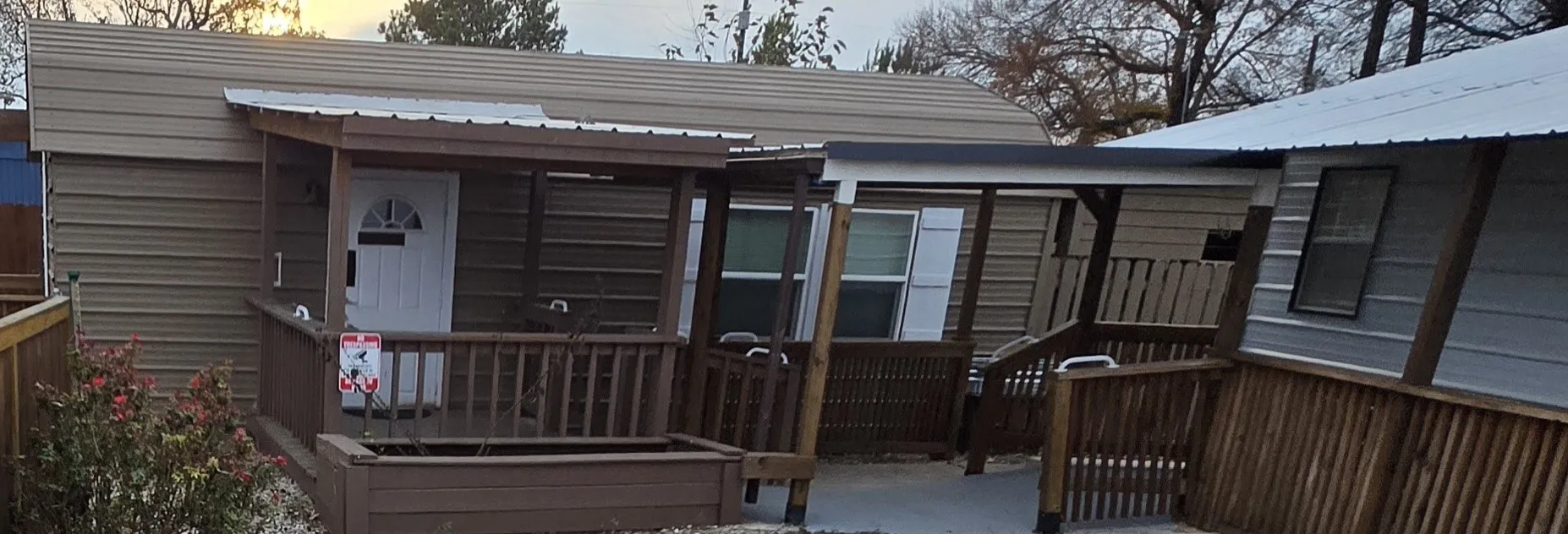 View of exterior entry featuring a metal roof,