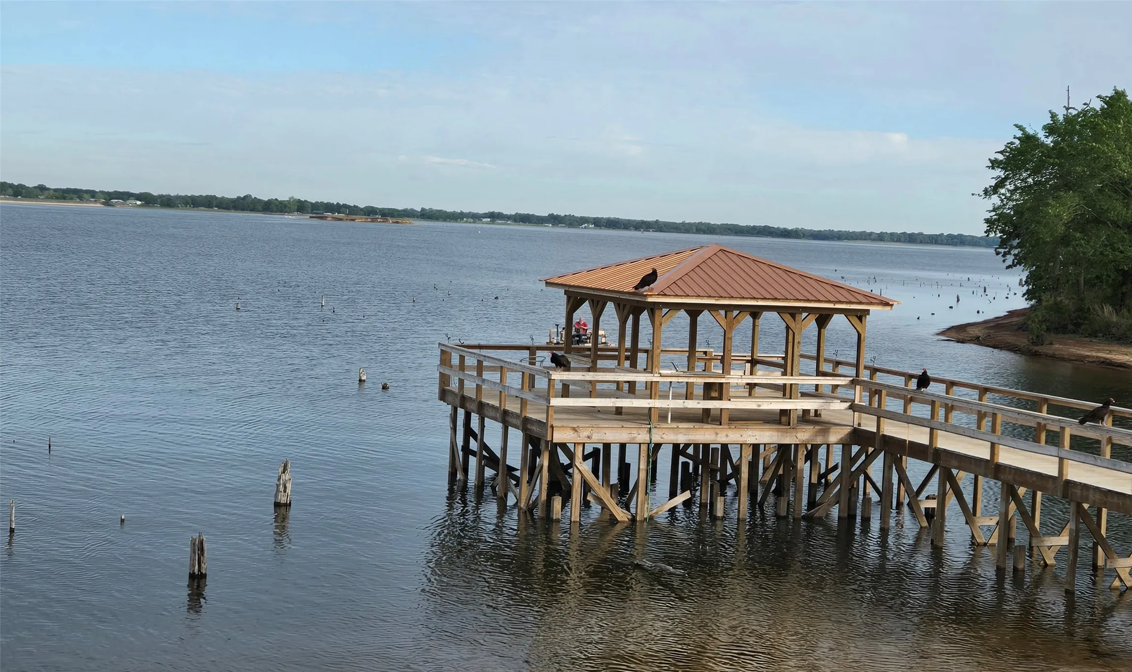 Dock featuring a gazebo and a water view