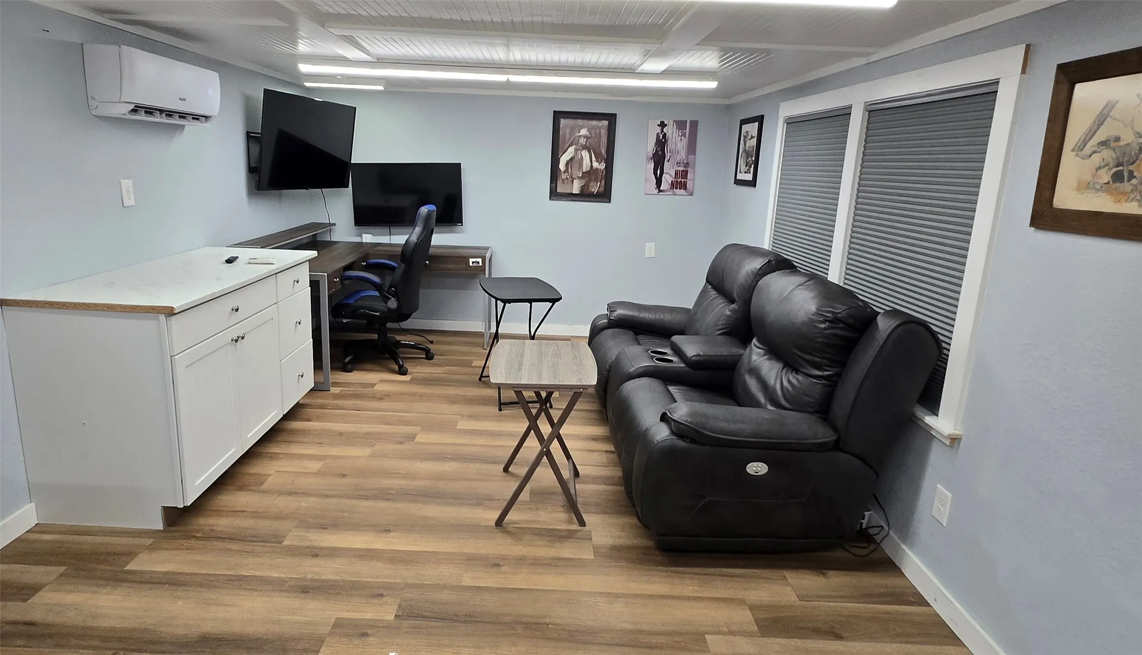 Home office with light wood-type flooring