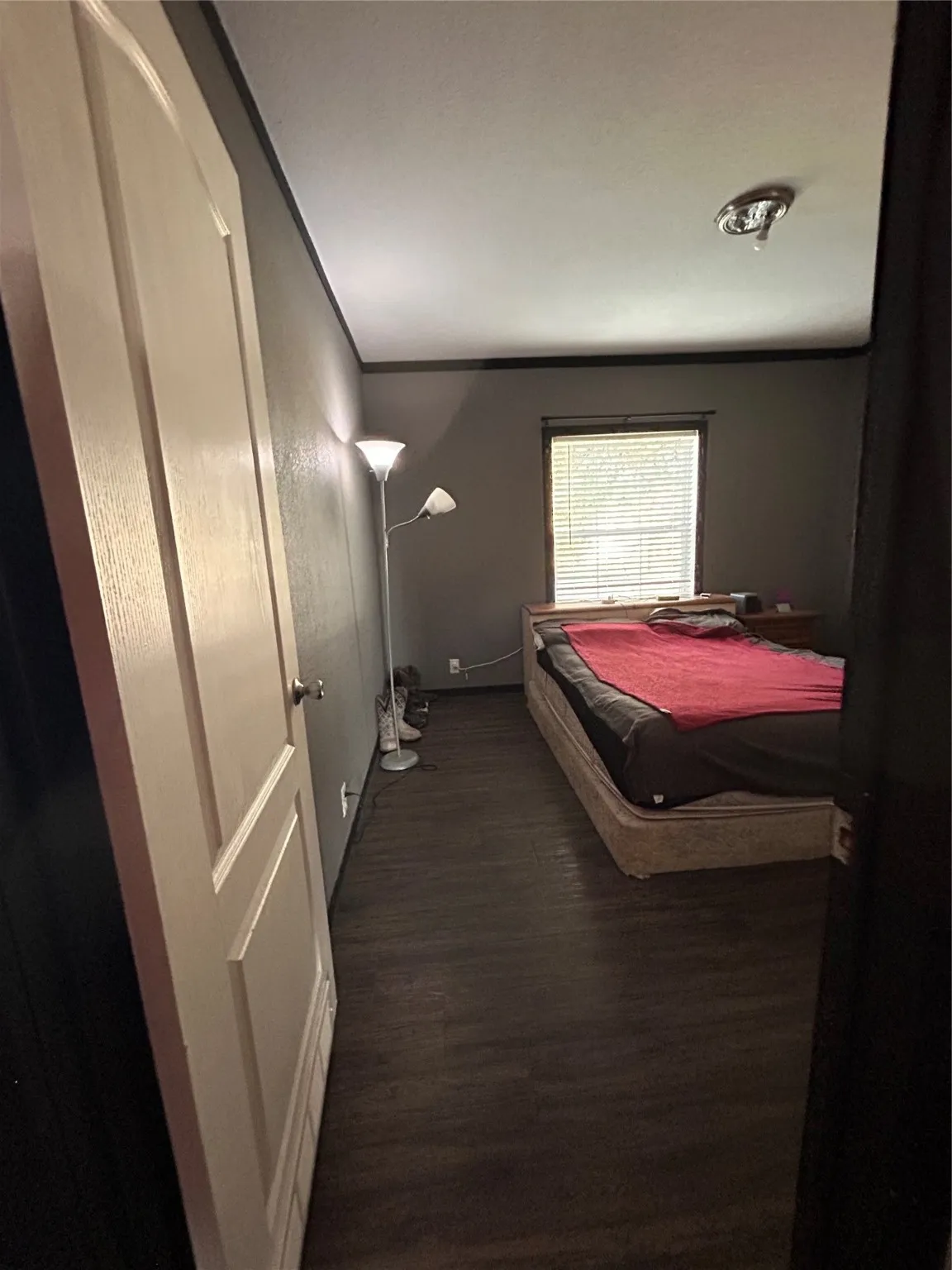 Bedroom with dark wood finished floors