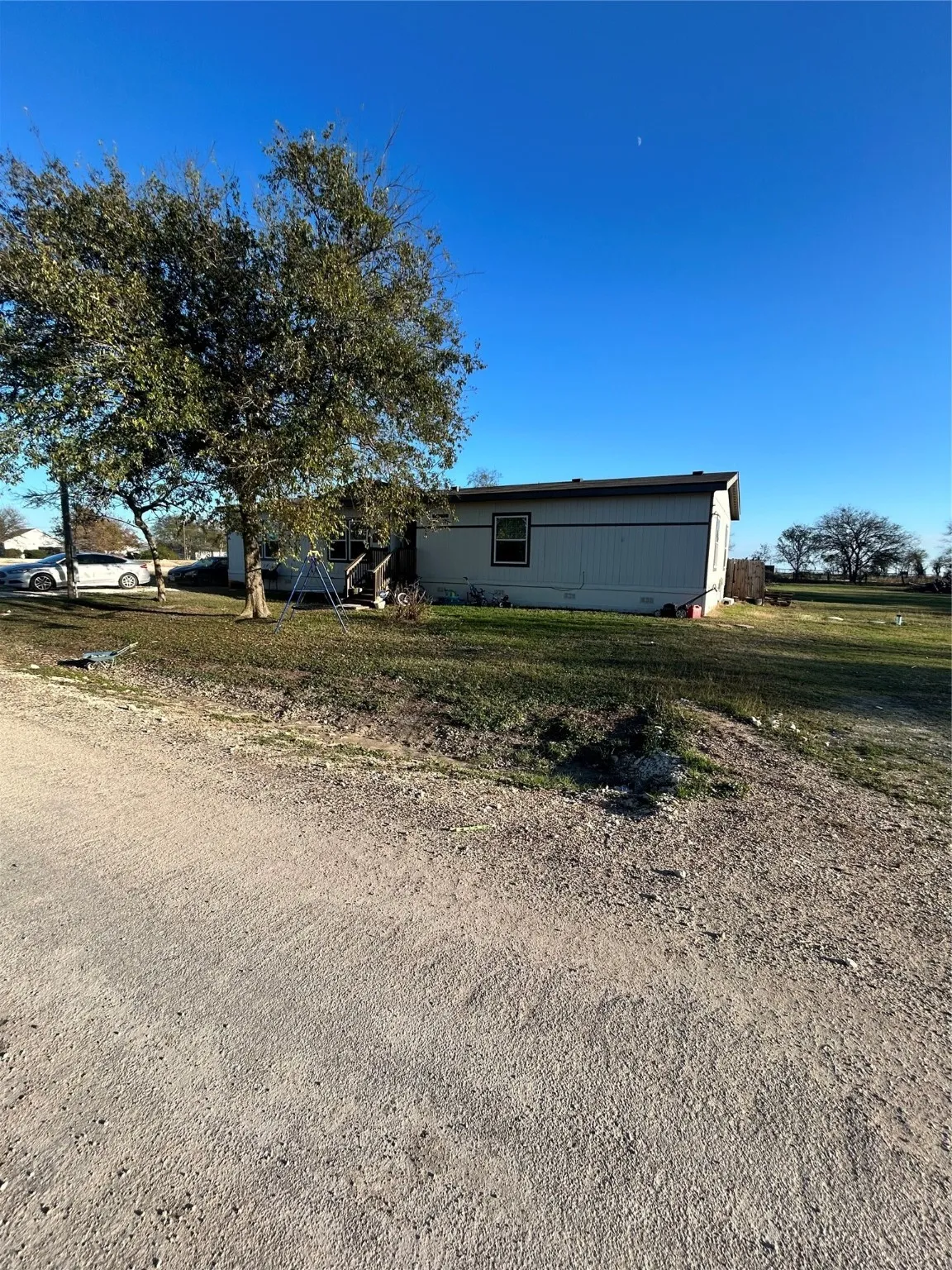 Ranch-style home with a front lawn