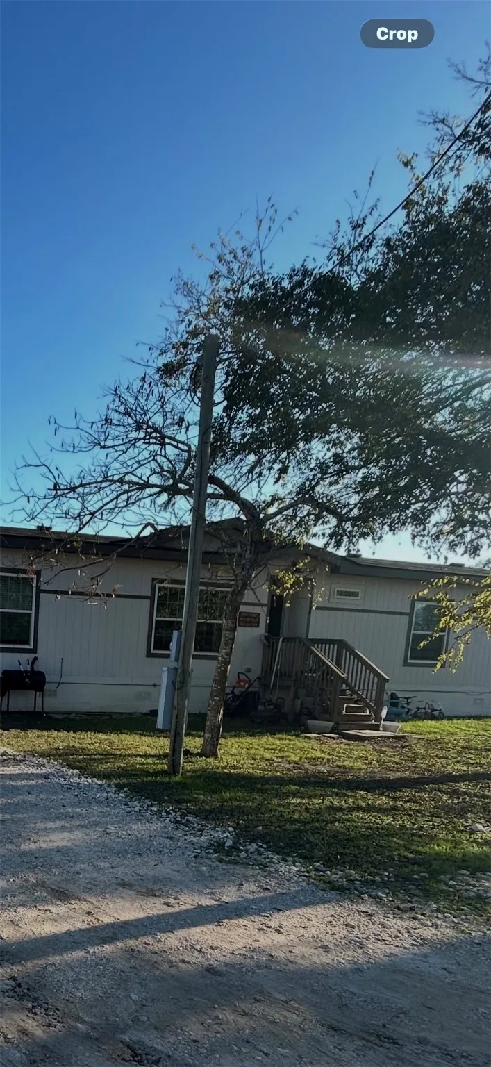 View of front of property featuring a front yard