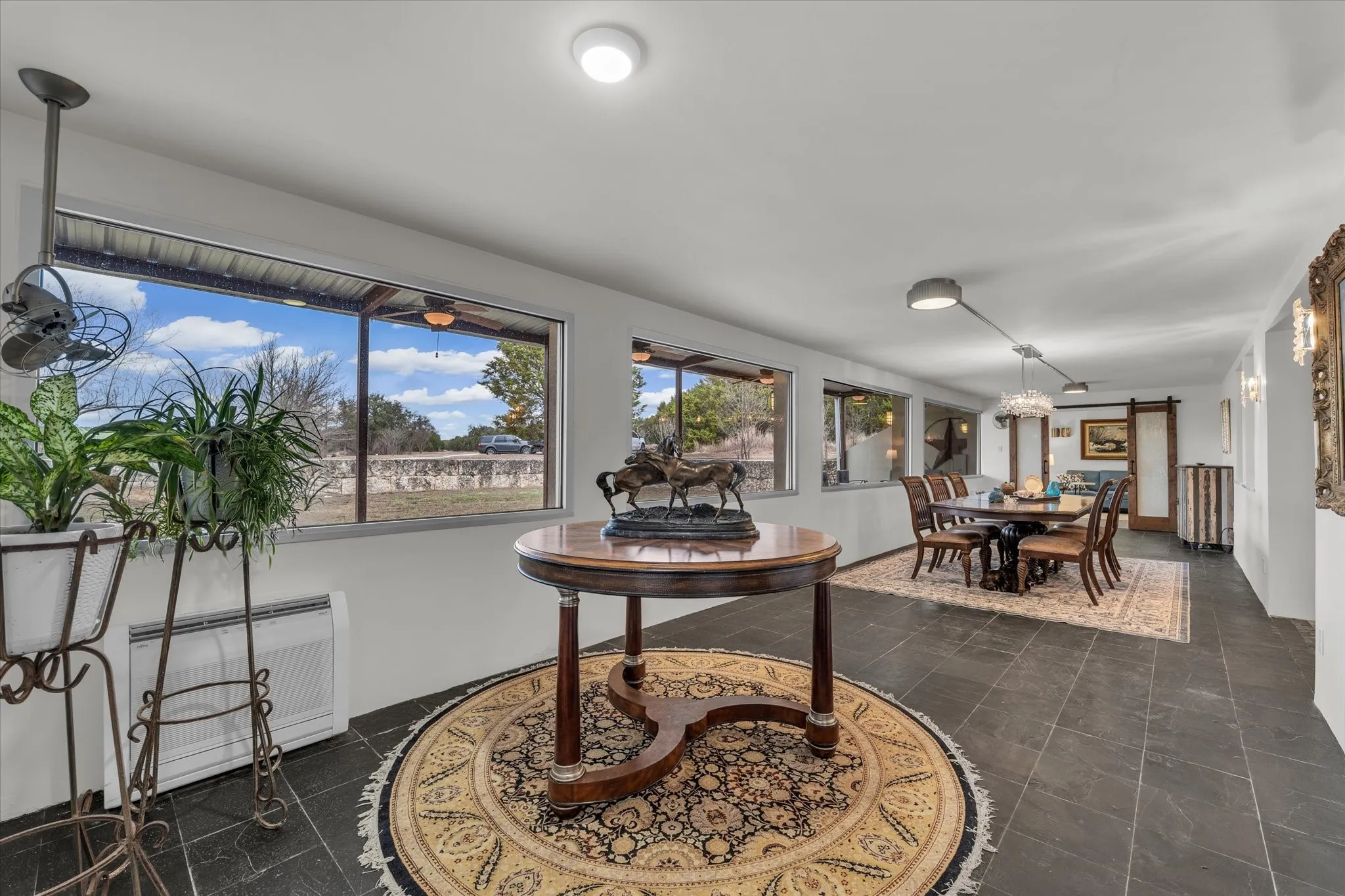 Entry and dining room with a barn door