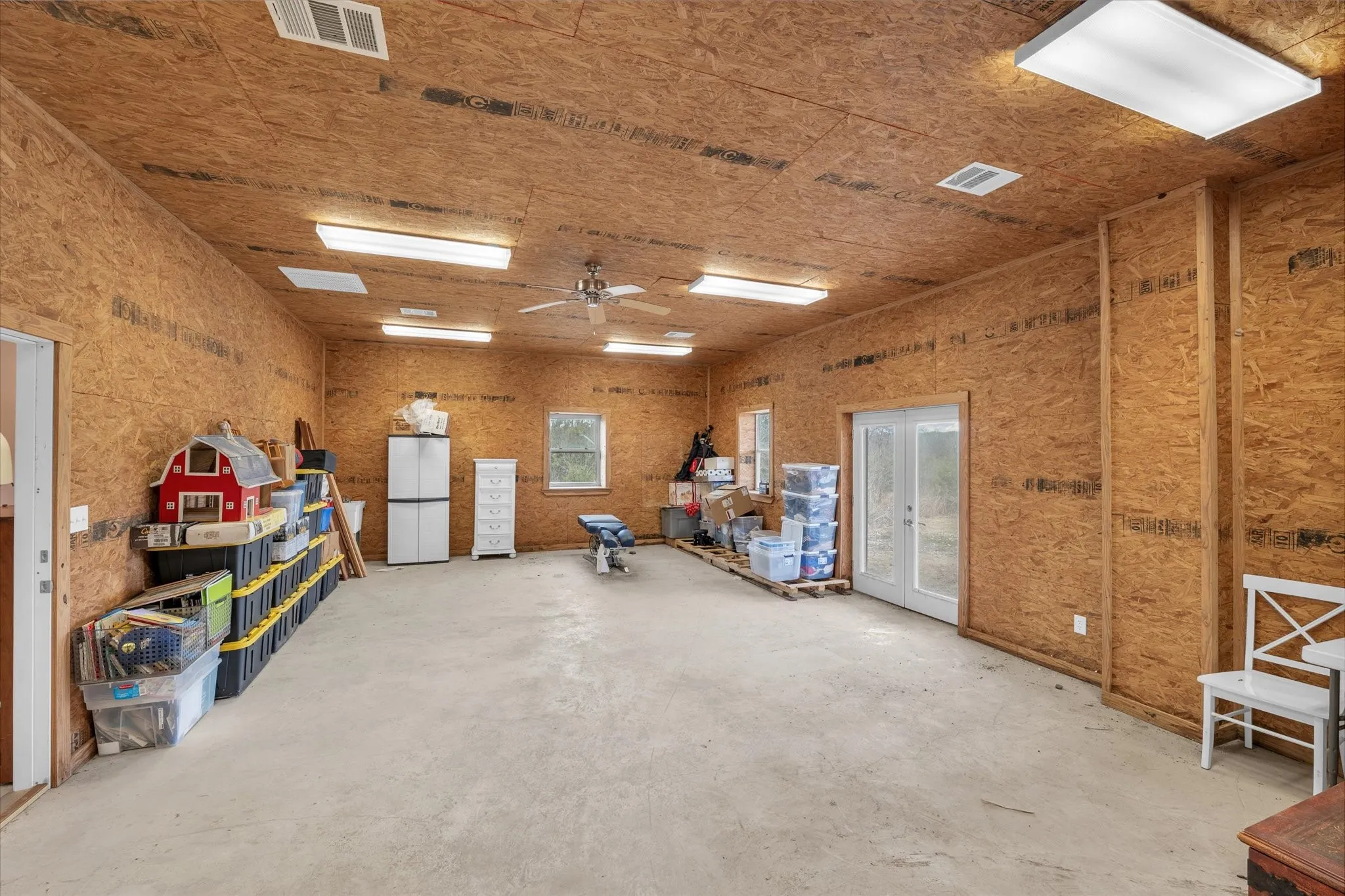Seperate room in workshop with ceiling fan