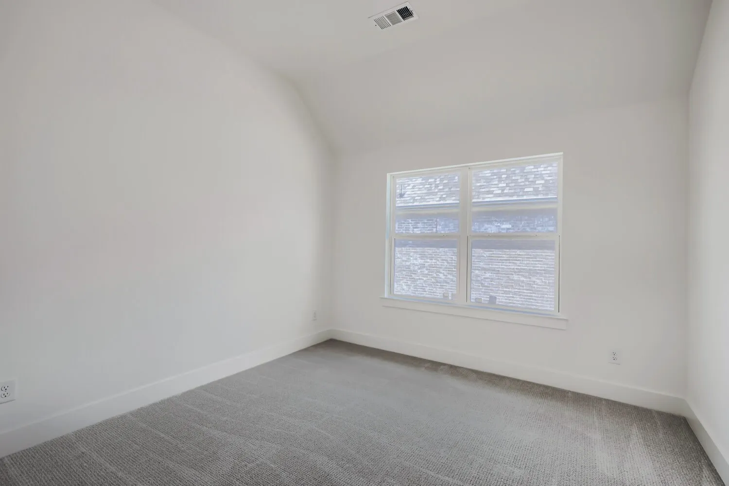 White-painted walls with matching trim and light gray patterned carpeting